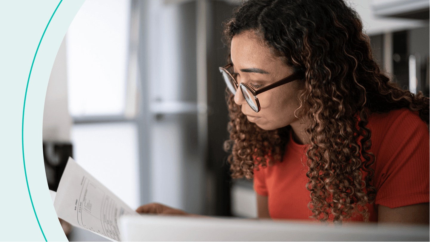 Woman looks over papers