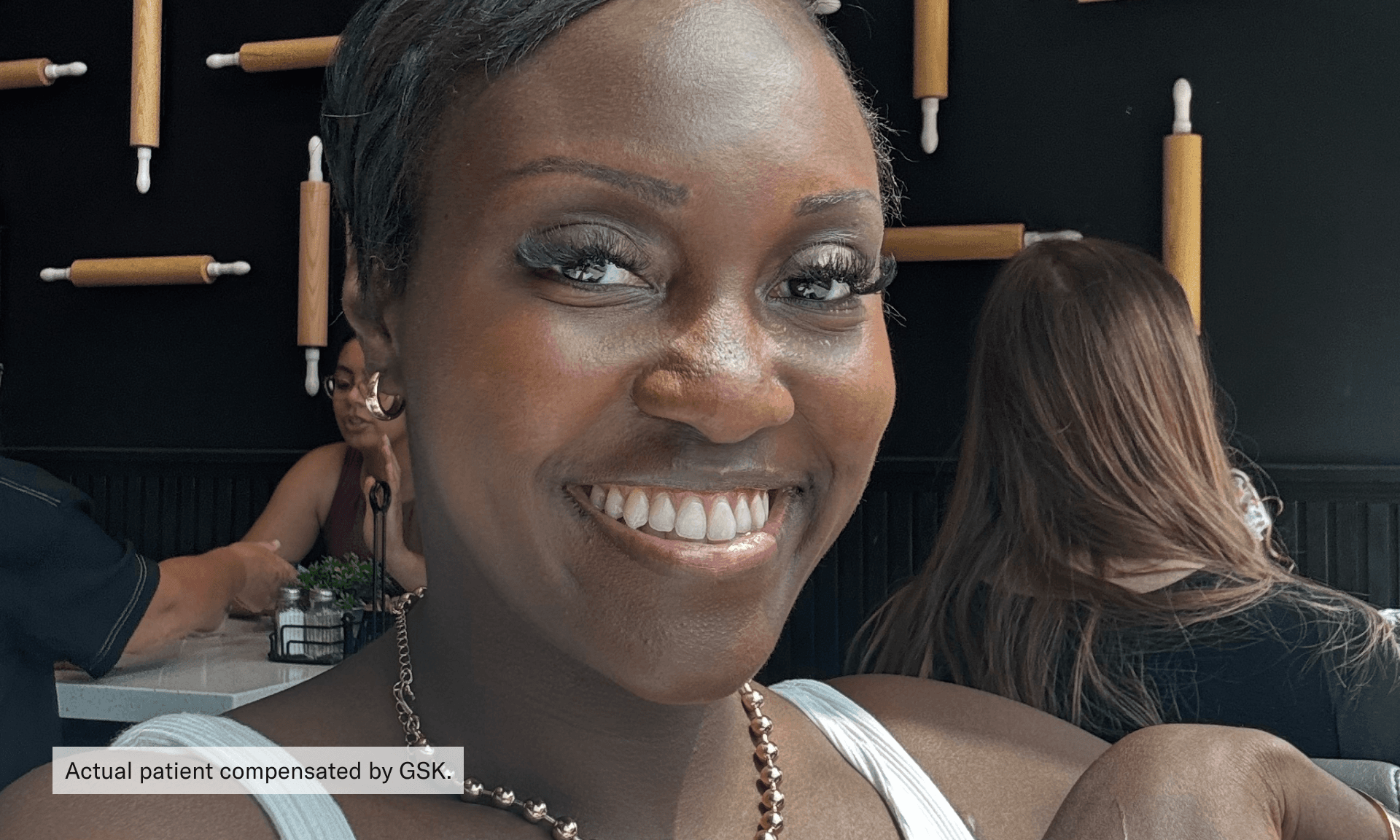 woman smiling (actual patient compensated by GSK)