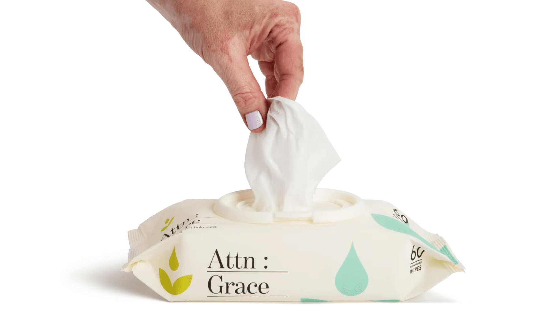 Hand pulling wipe out of cream package with green and blue illustrations