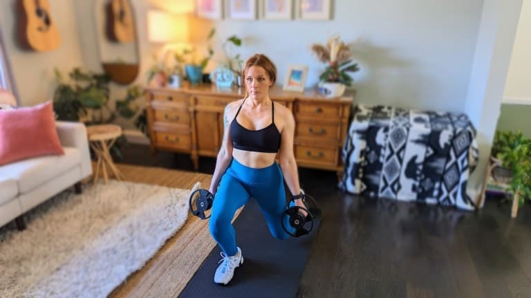 Personal trainer demonstrating walking lunge