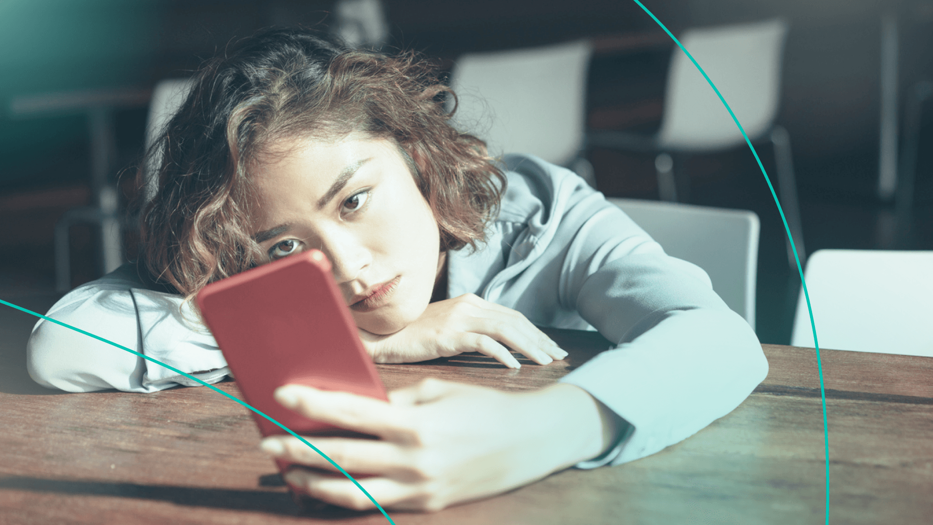 woman looking annoyed at phone
