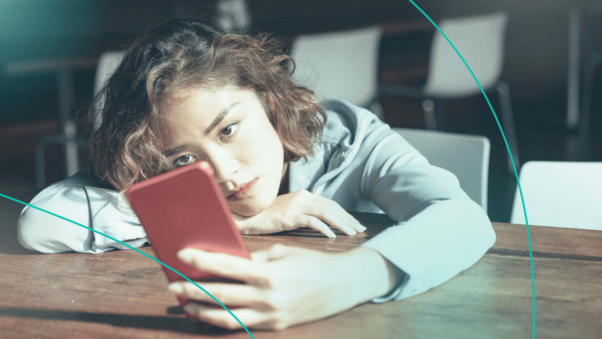 woman looking annoyed at phone