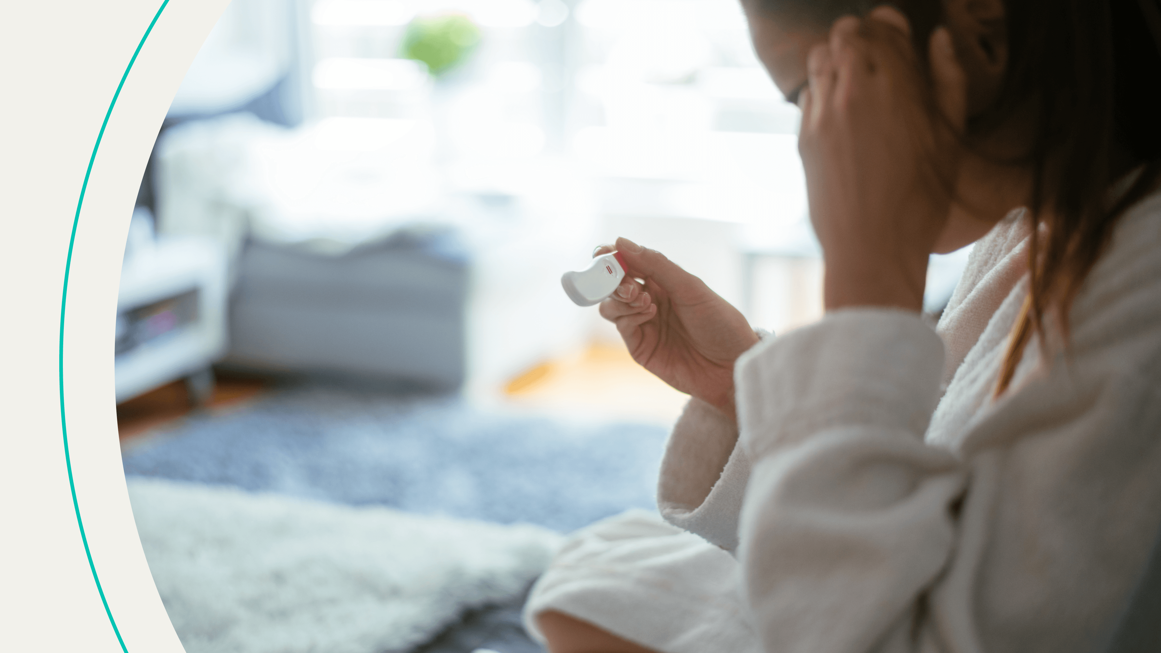 A woman holding a pregnancy test