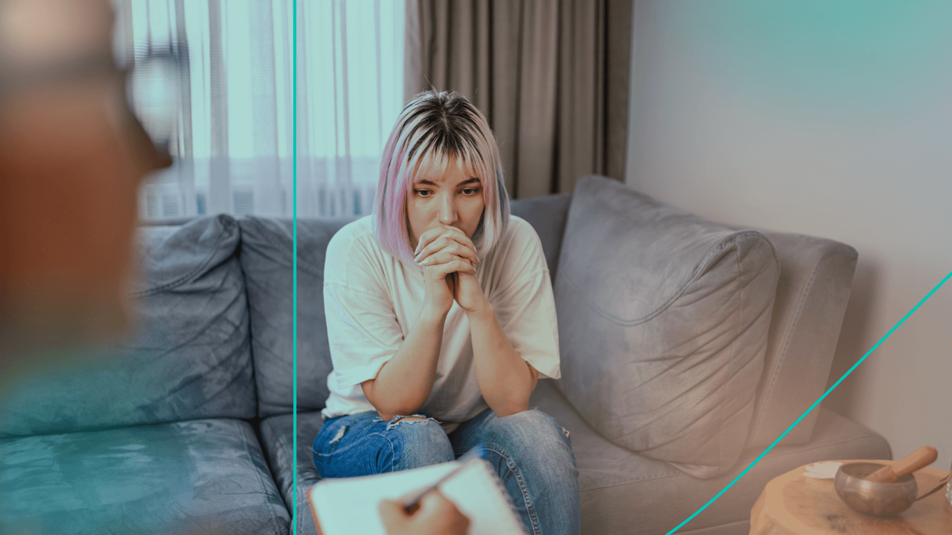 Woman looking upset sitting on couch with therapist