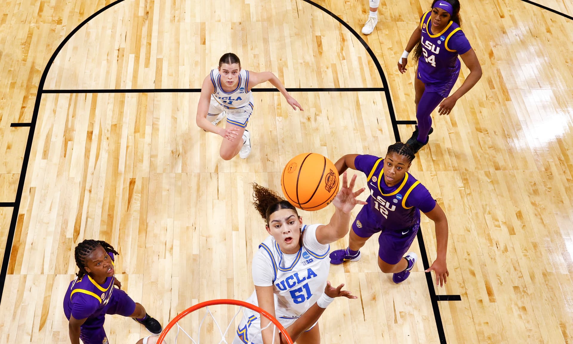 Lauren Betts #51 of the UCLA Bruins goes to the basket against the LSU Lady Tigers