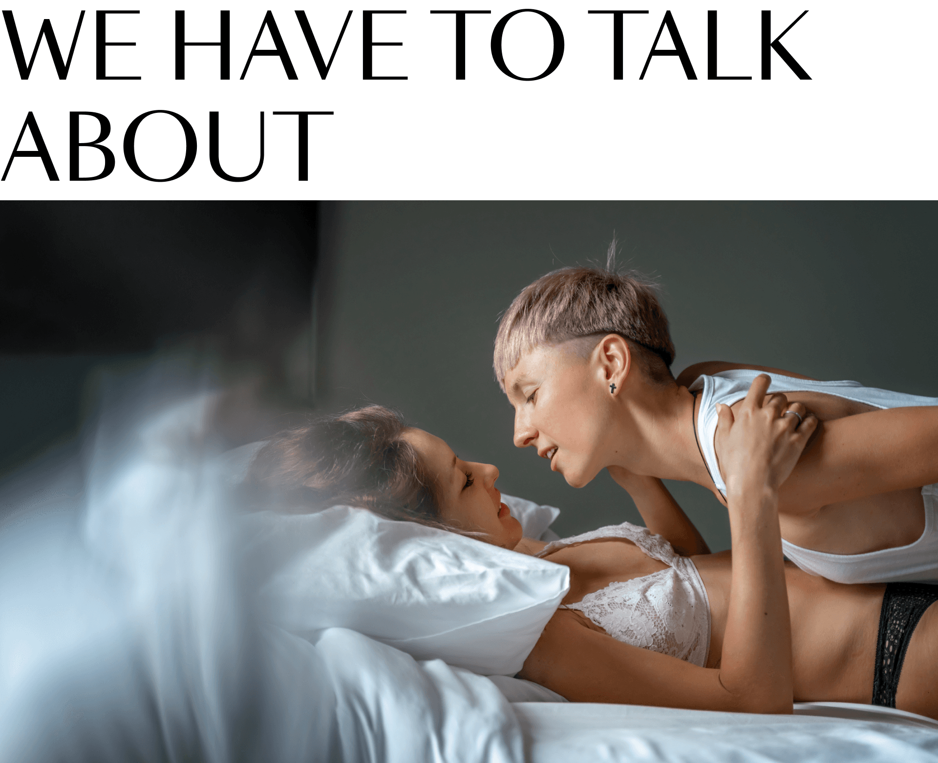 Women hugging in bed