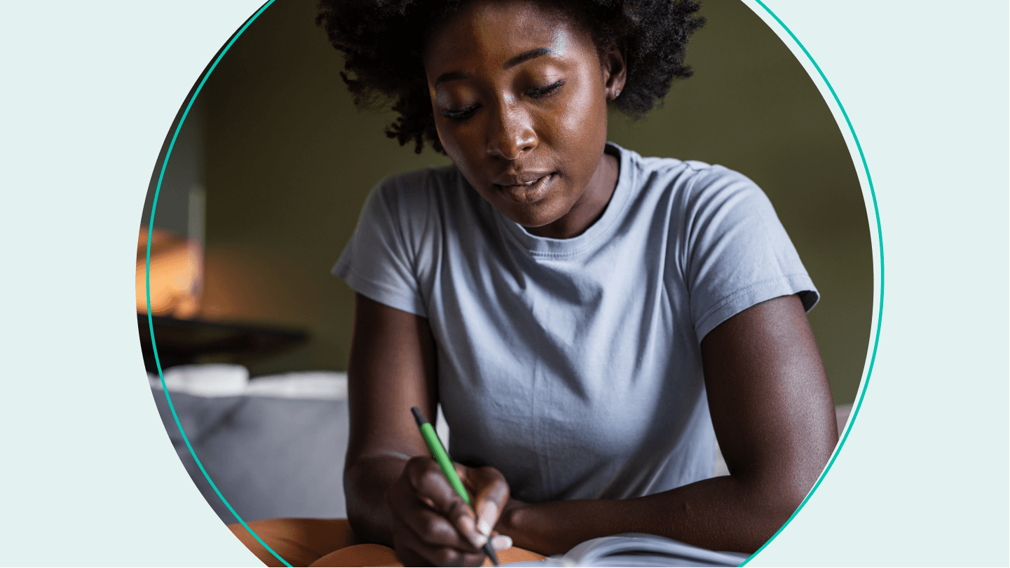 woman writing in notebook