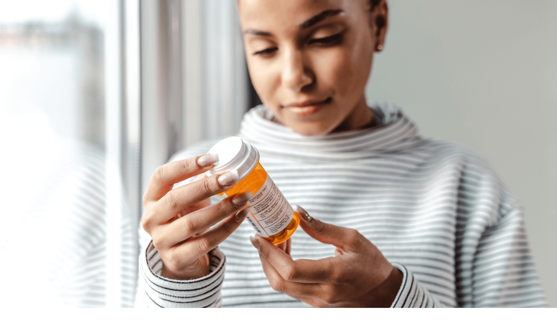 Woman looking at prescription