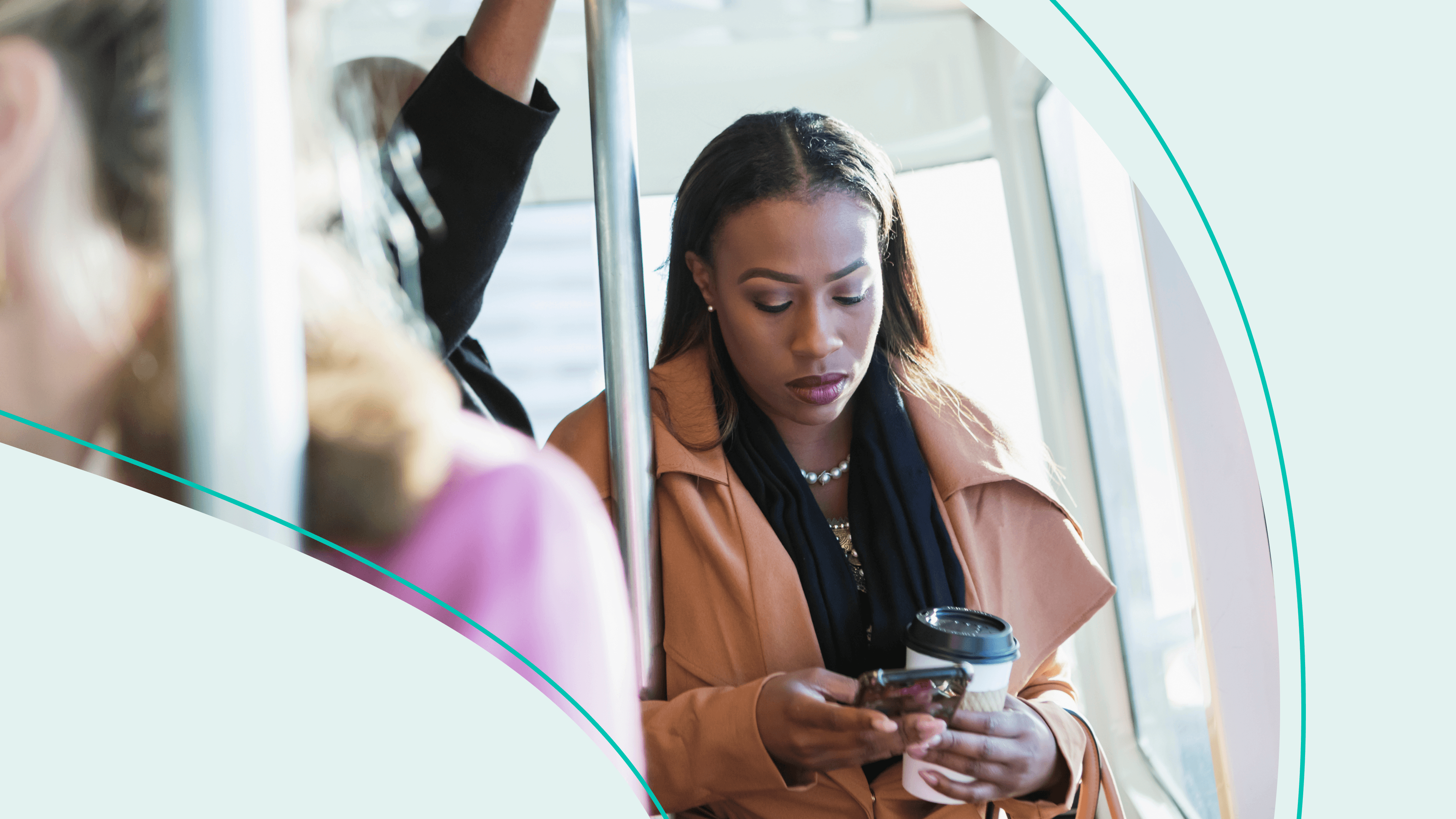 A woman commuting to the office on public transit looking at her phone