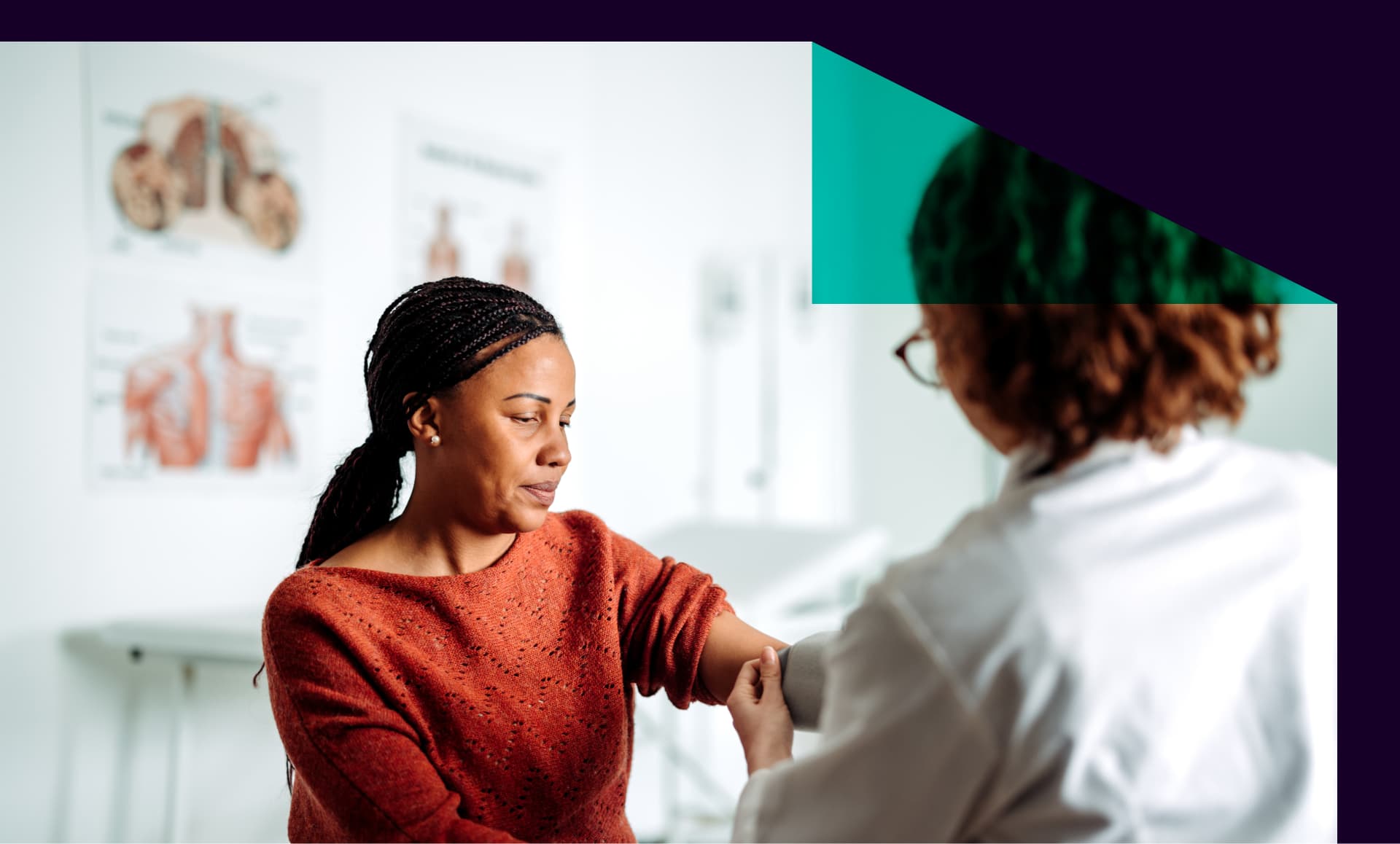A young female doctor measuring a woman’s blood pressure during a routine checkup in a medical office.