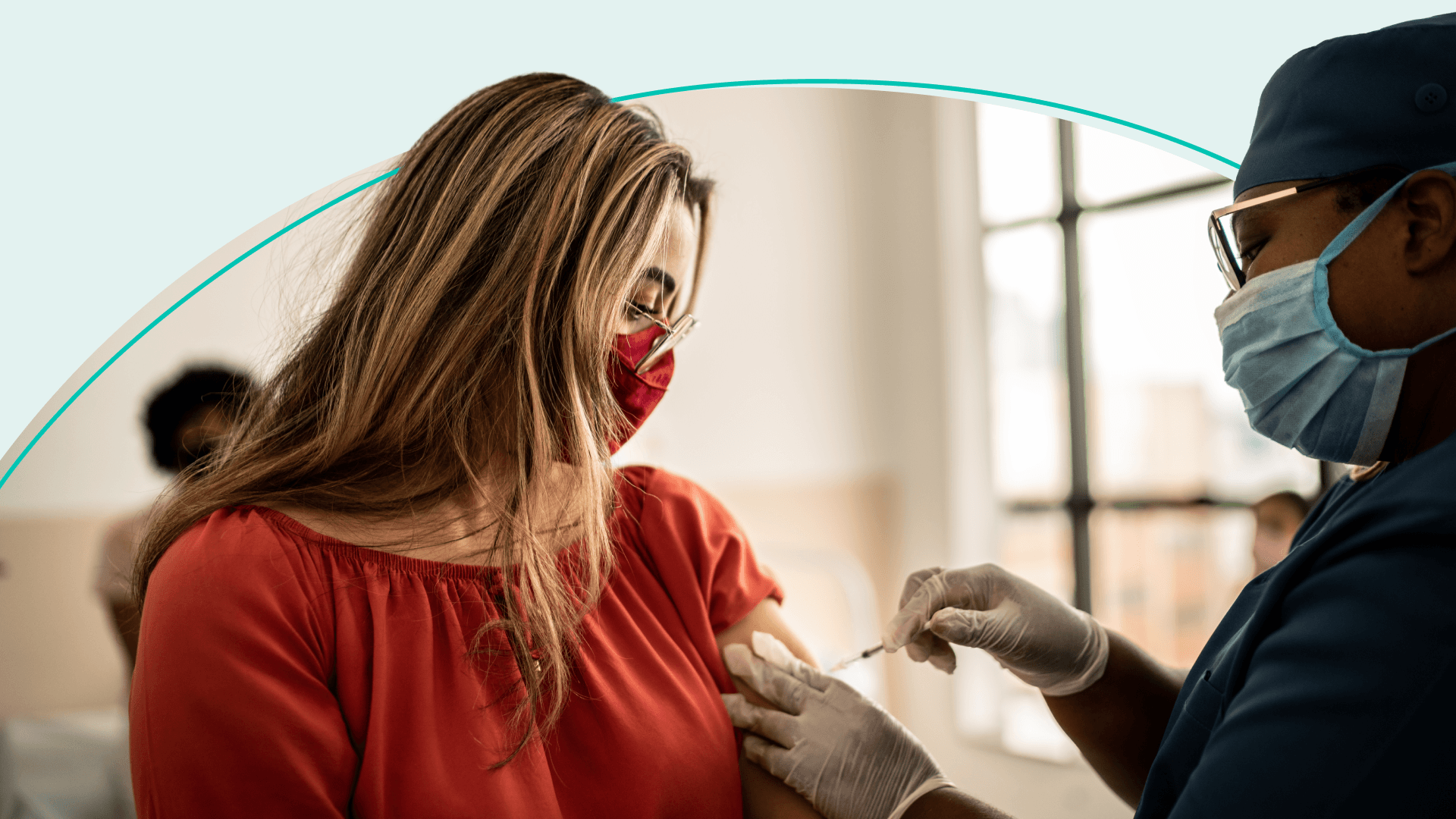 A woman getting an injection by a health care professional