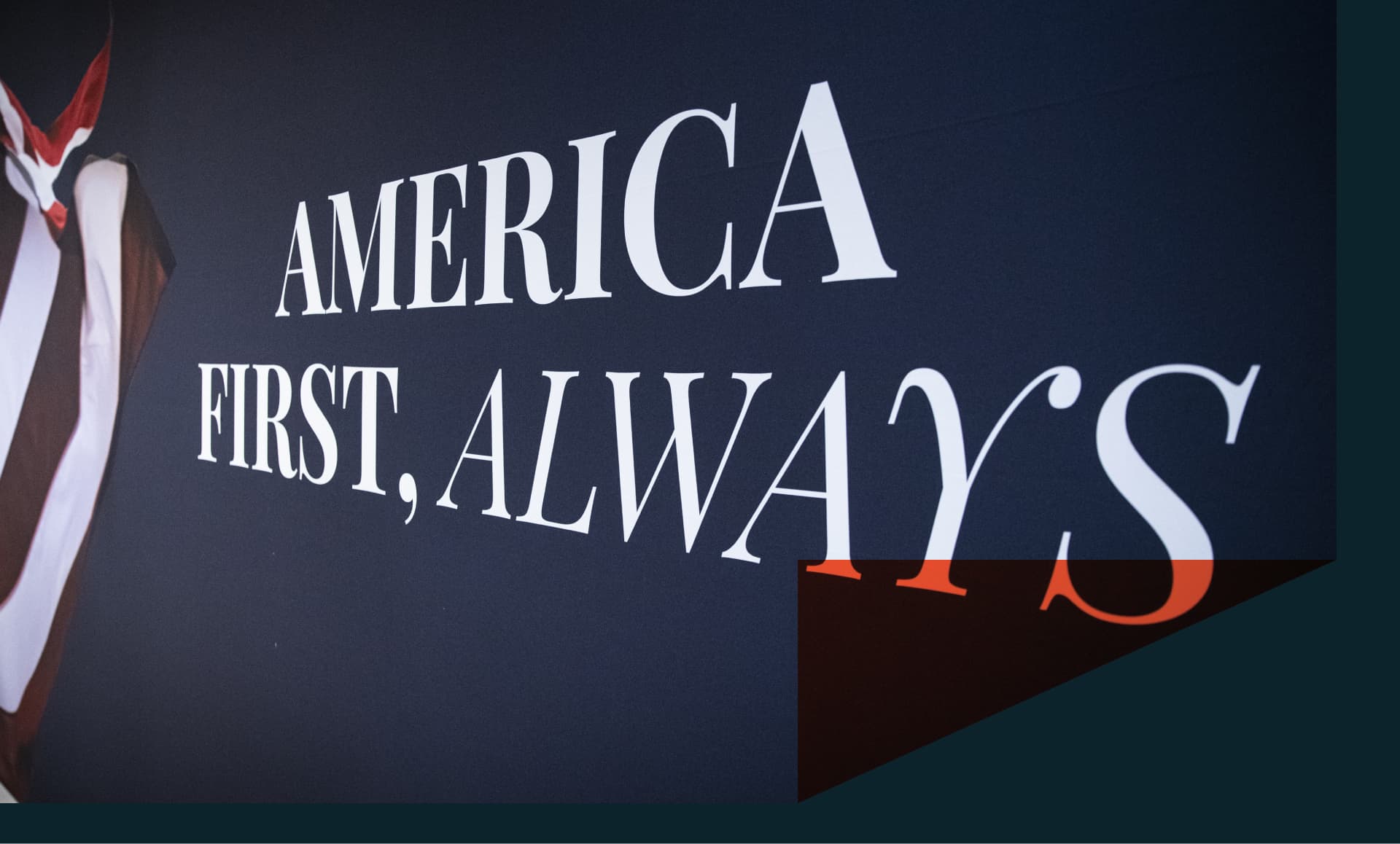 An "America First" mural is displayed on a wall.