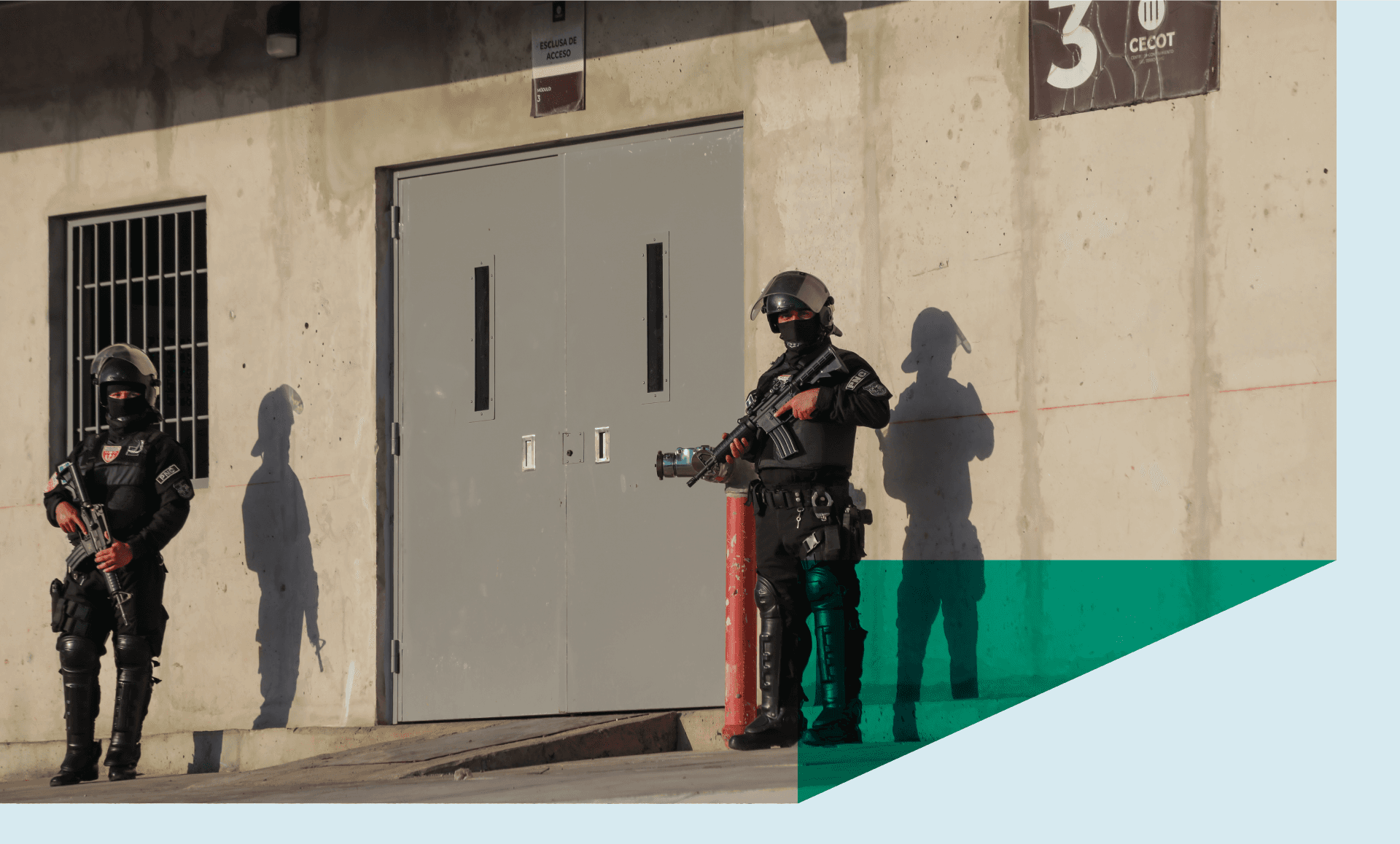Prison officers guarding an access gate at the Terrorism Confinement Center (CECOT) in Tecoluca, in San Vicente, El Salvador