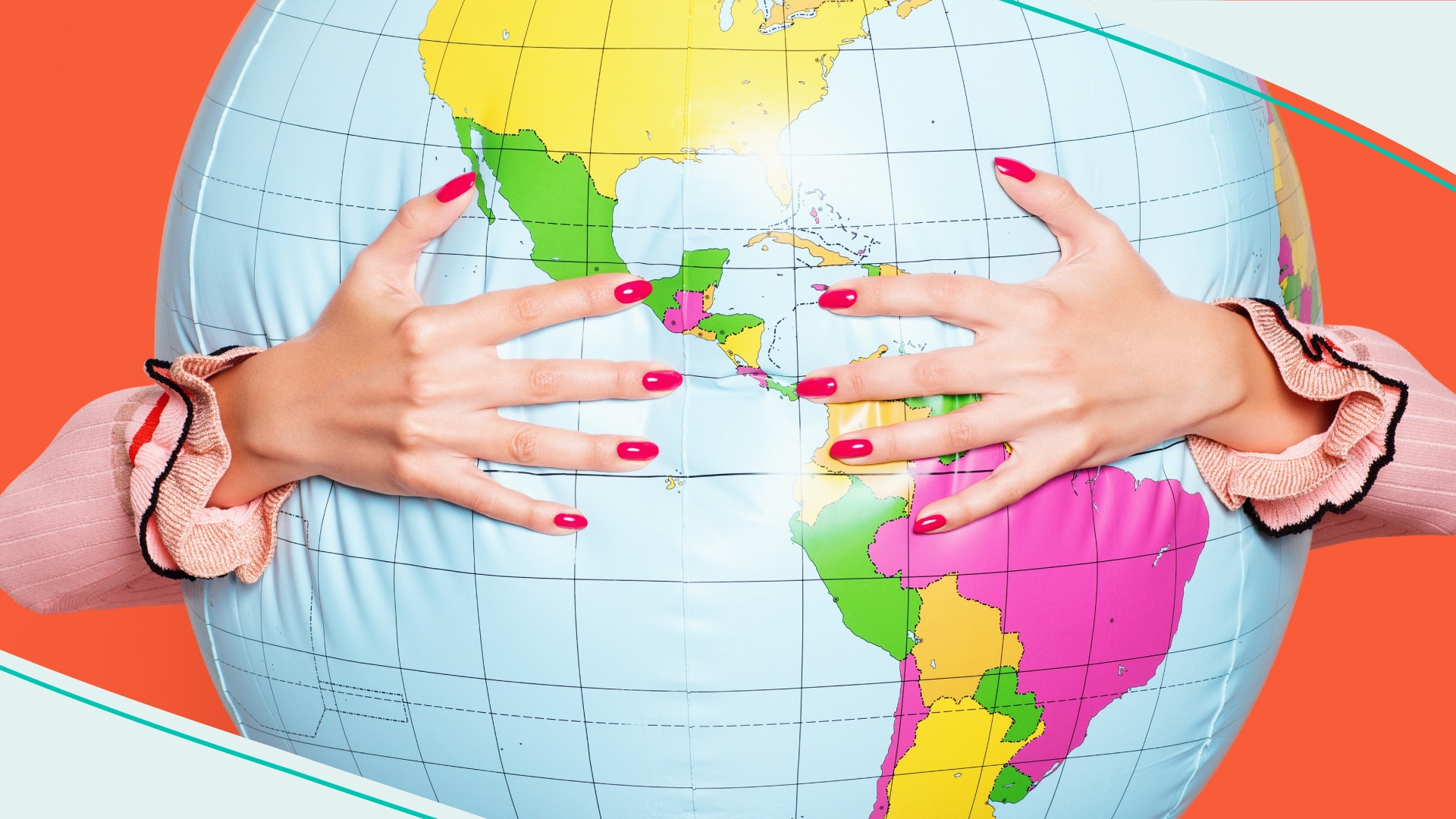 Large inflatable globe getting hugged by a woman in a red skirt.