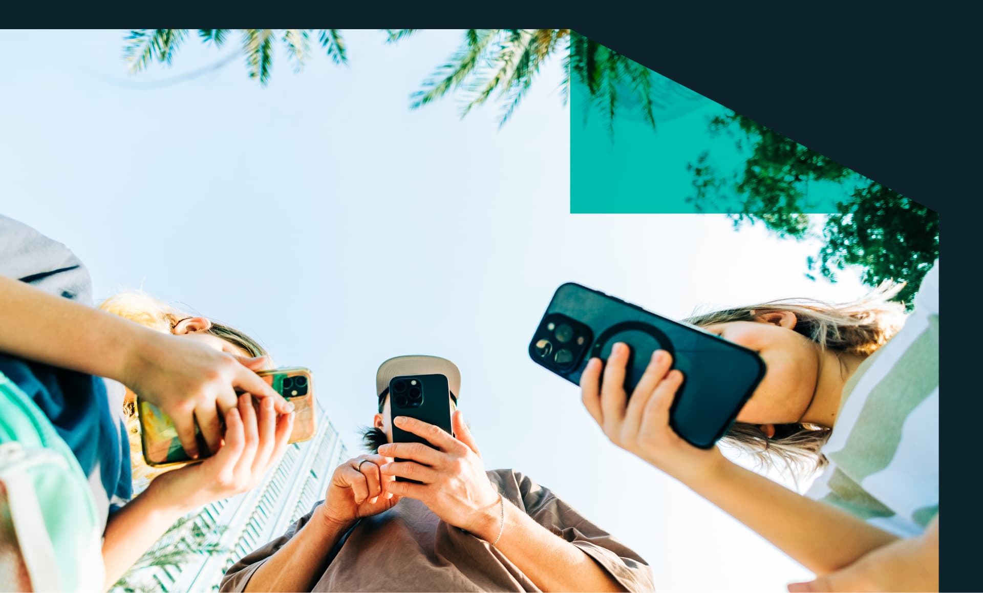 Group of people using smartphones outdoors