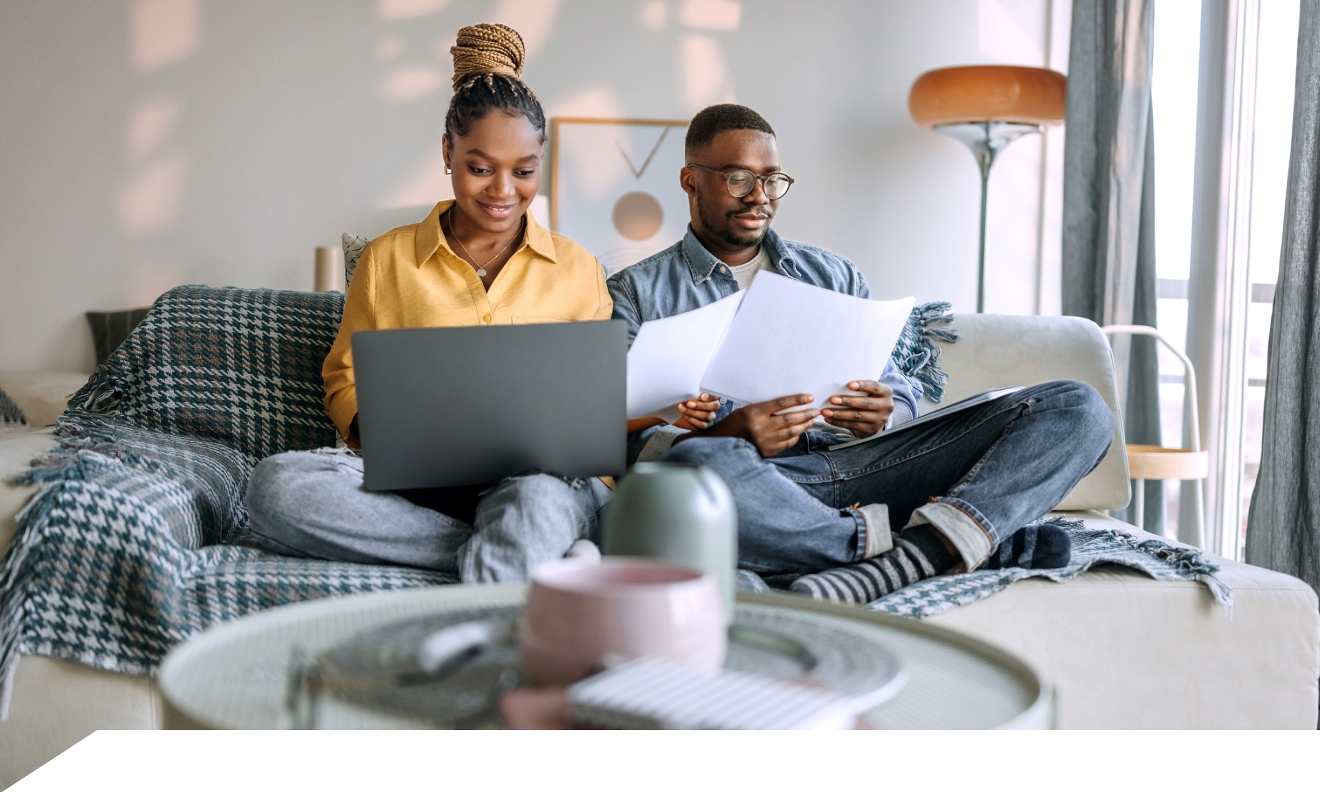 A couple in bed on their laptop