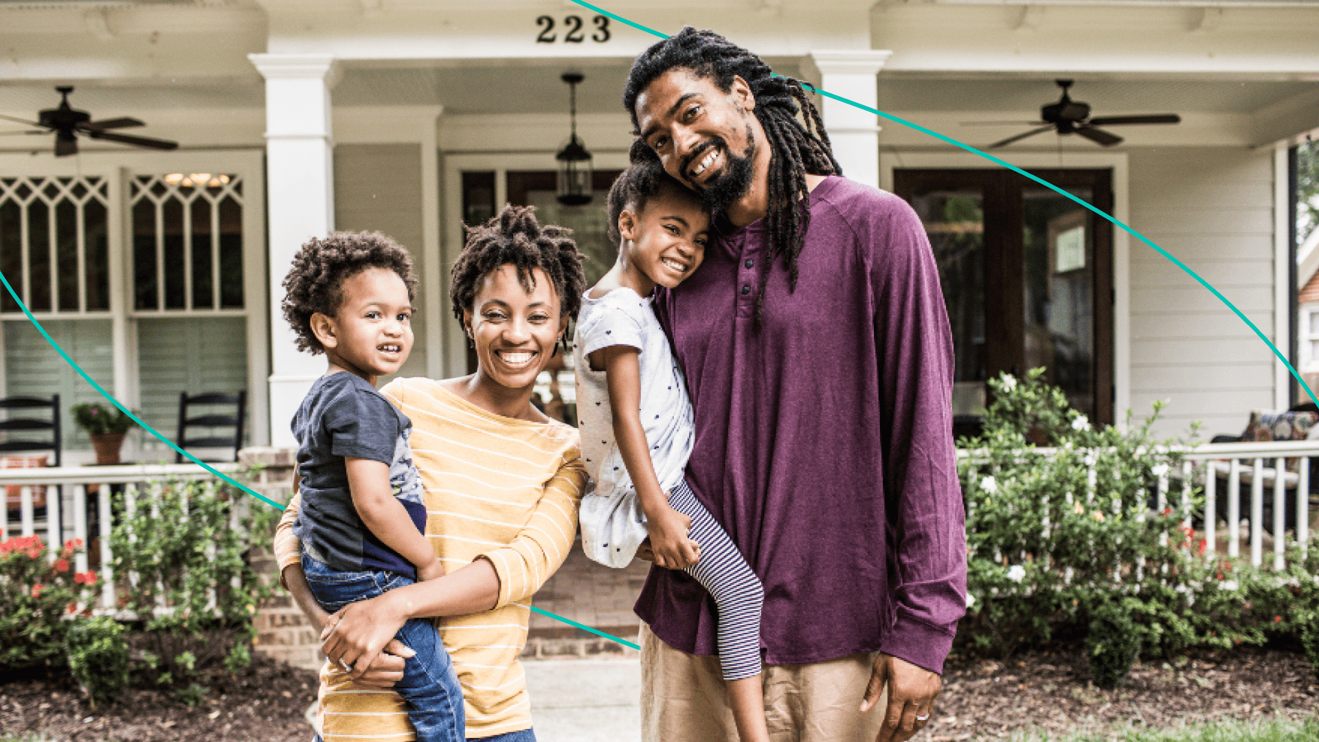 A young family outside of their home