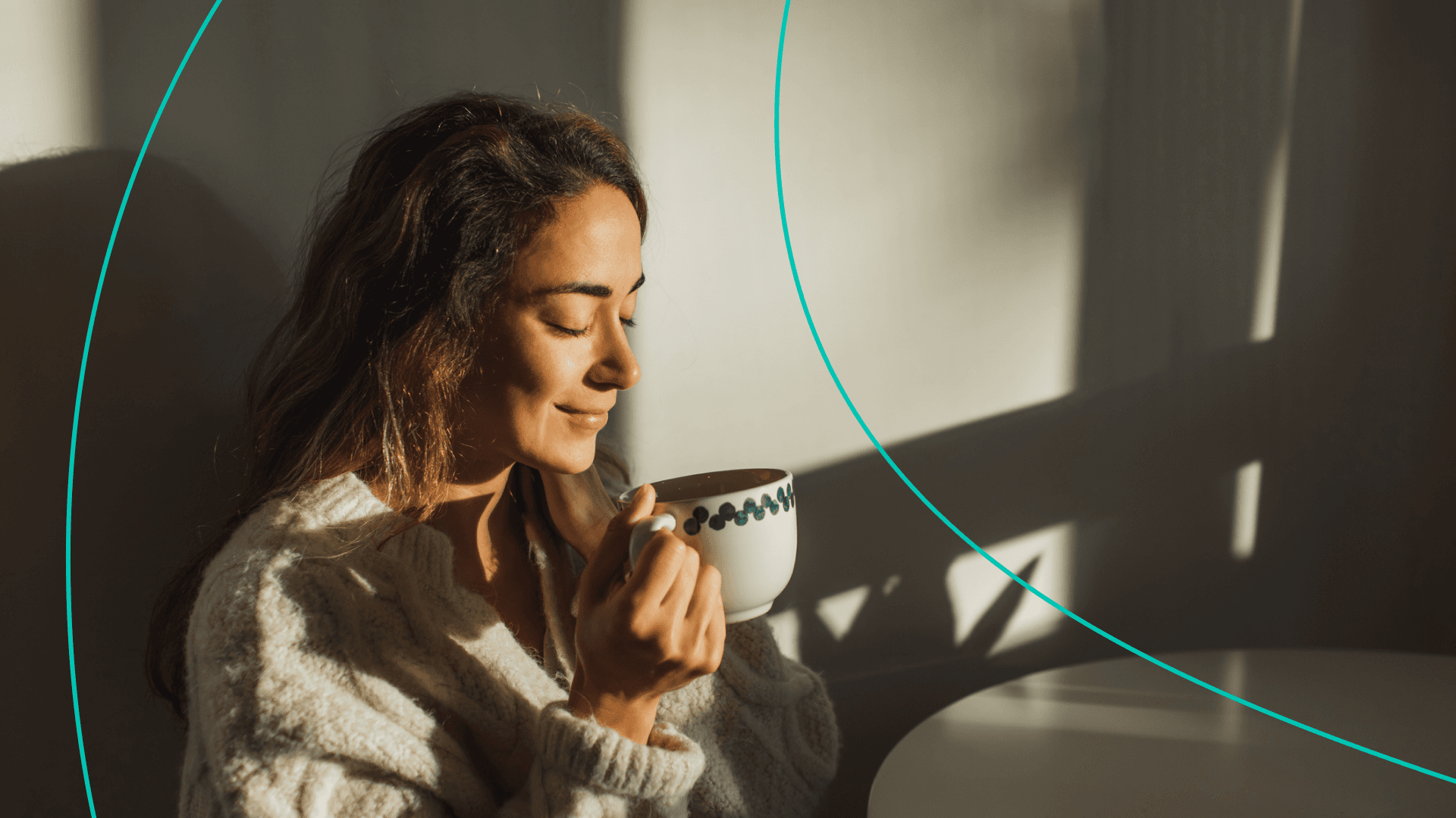 Woman holding cup while smiling