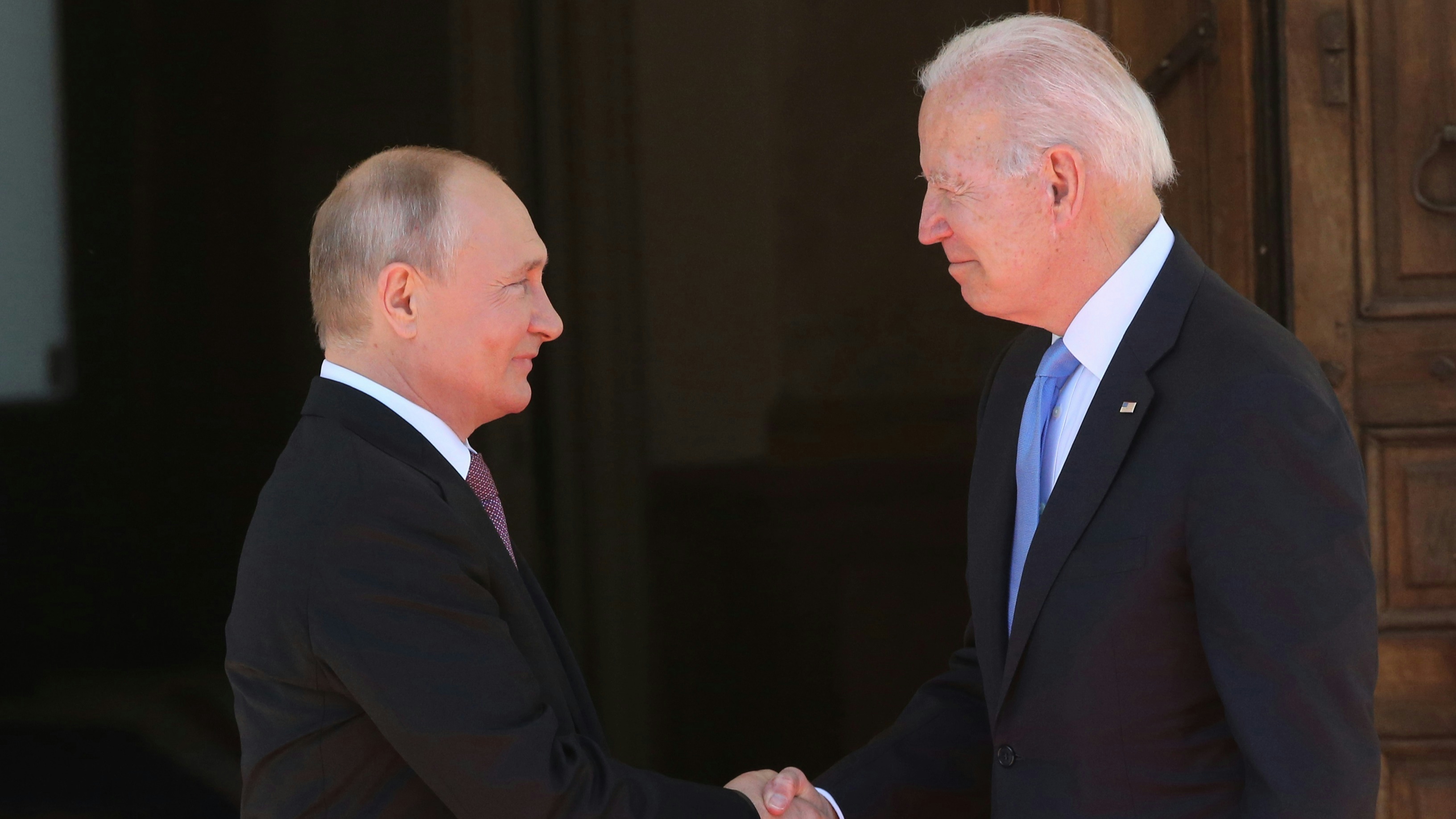 Russian President Vladimir Putin greets US President Joe Biden during the US - Russia Summit.