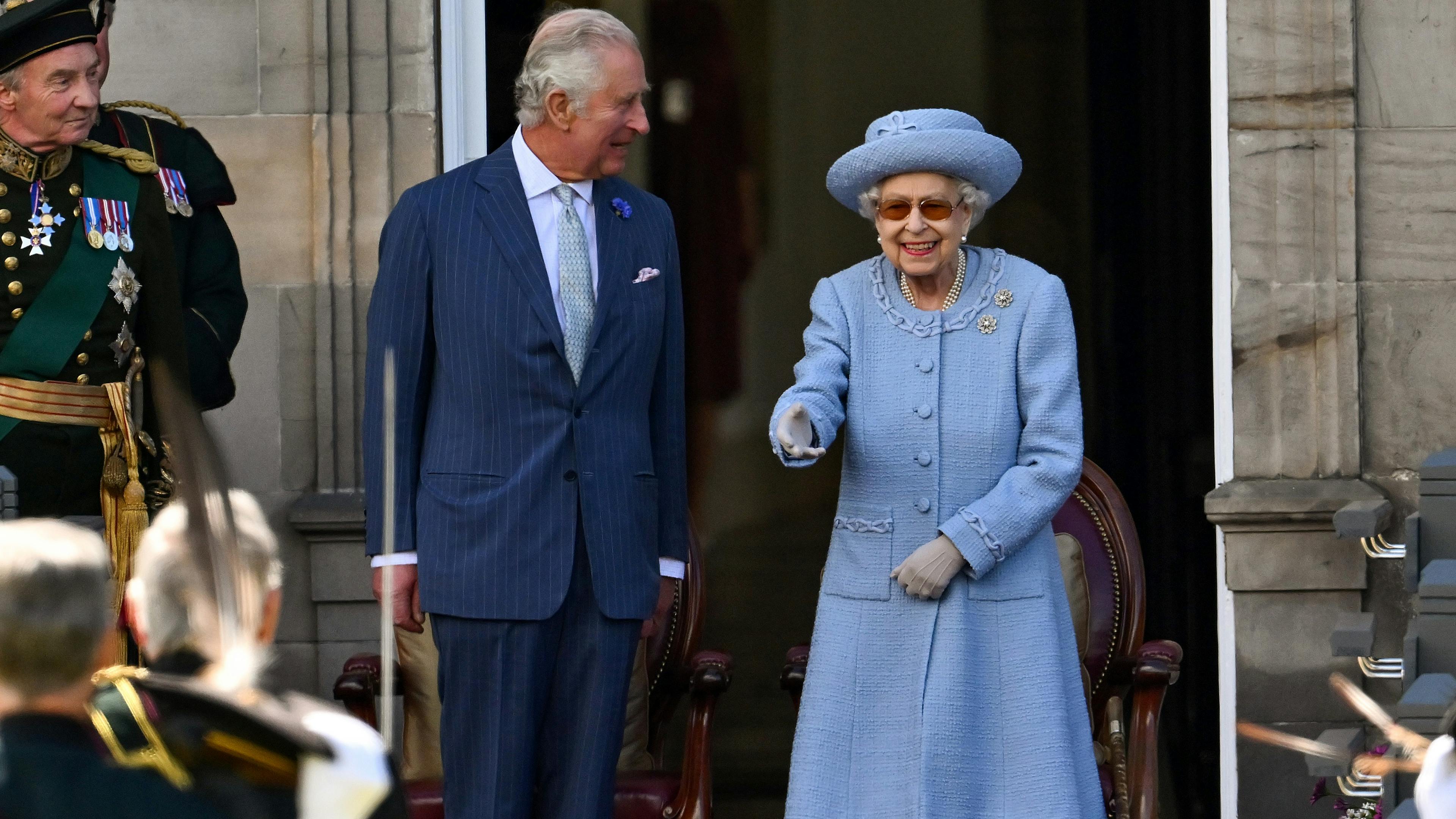 Queen Elizabeth smiling and greeting