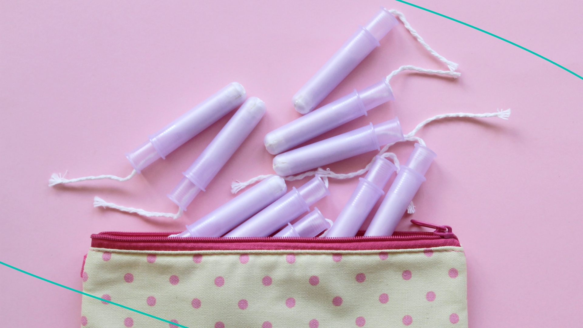Menstrual bag with cotton tampons, sanitary napkins and pills on pink background