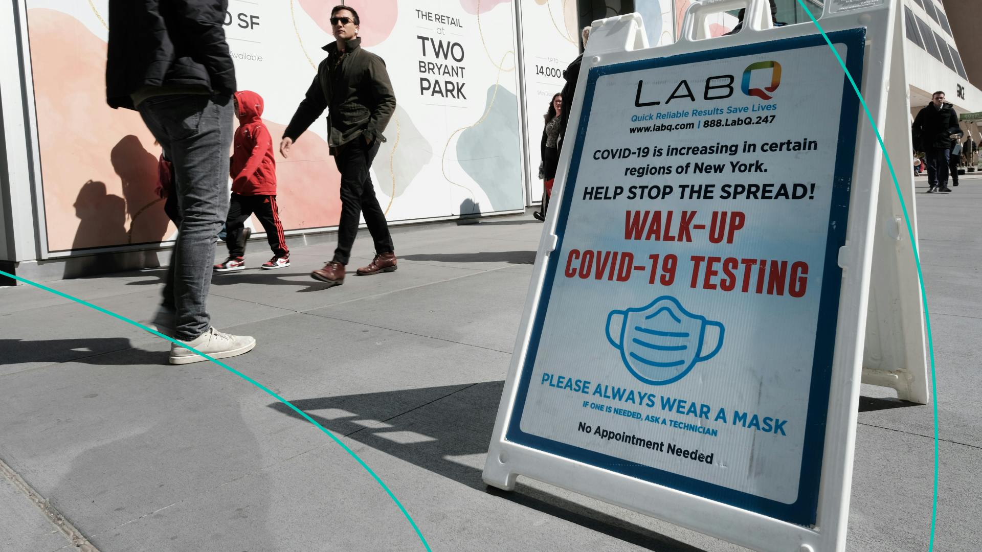 A sign for a Covid-19 testing tent sits along a Manhattan street