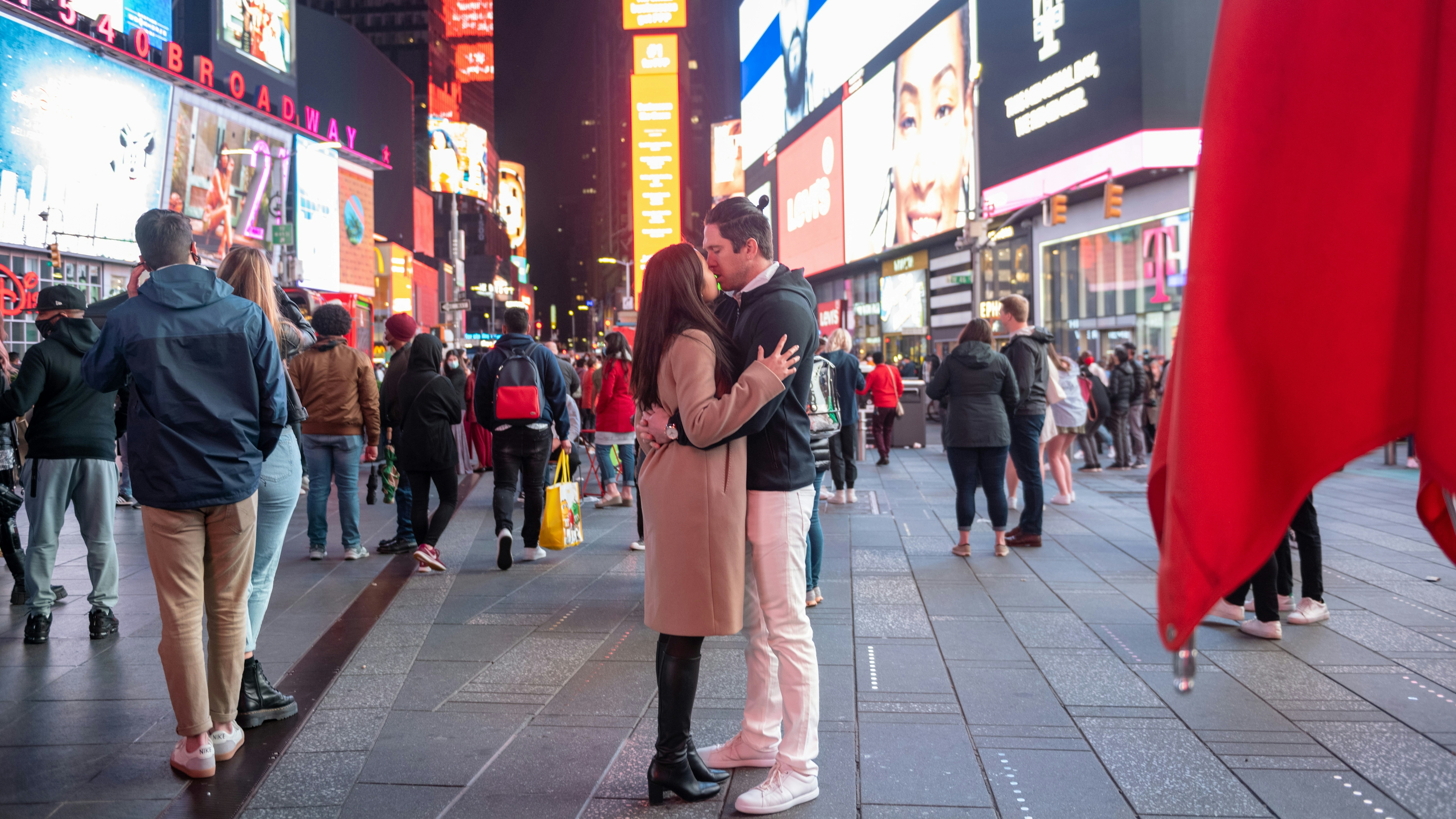 A couple kisses in Times Square on Memorial Day weekend on May 29, 2021 in New York City. On May 19, 2021.