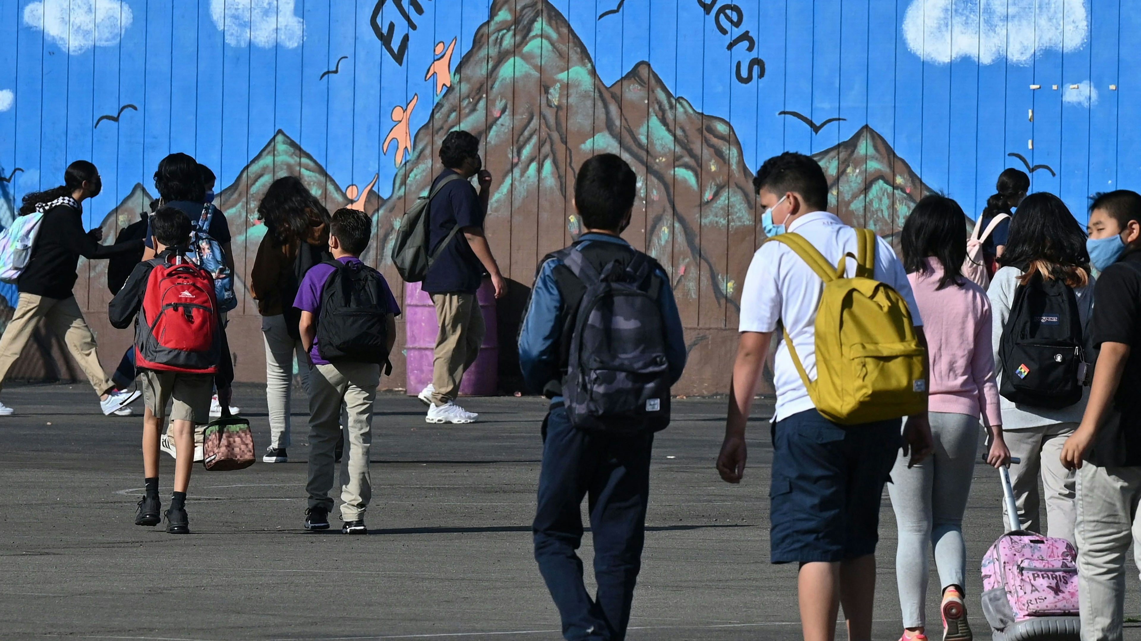 Students walk to their classrooms at a public middle school in Los Angeles, California,