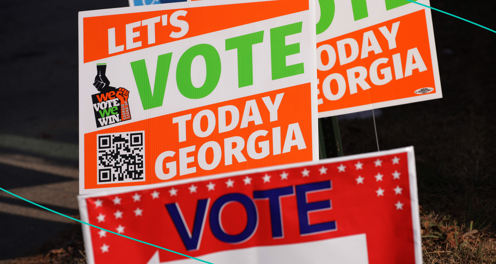 Signs that encourage people to vote are seen outside a polling station on November 29, 2022 in Atlanta, Georgia.