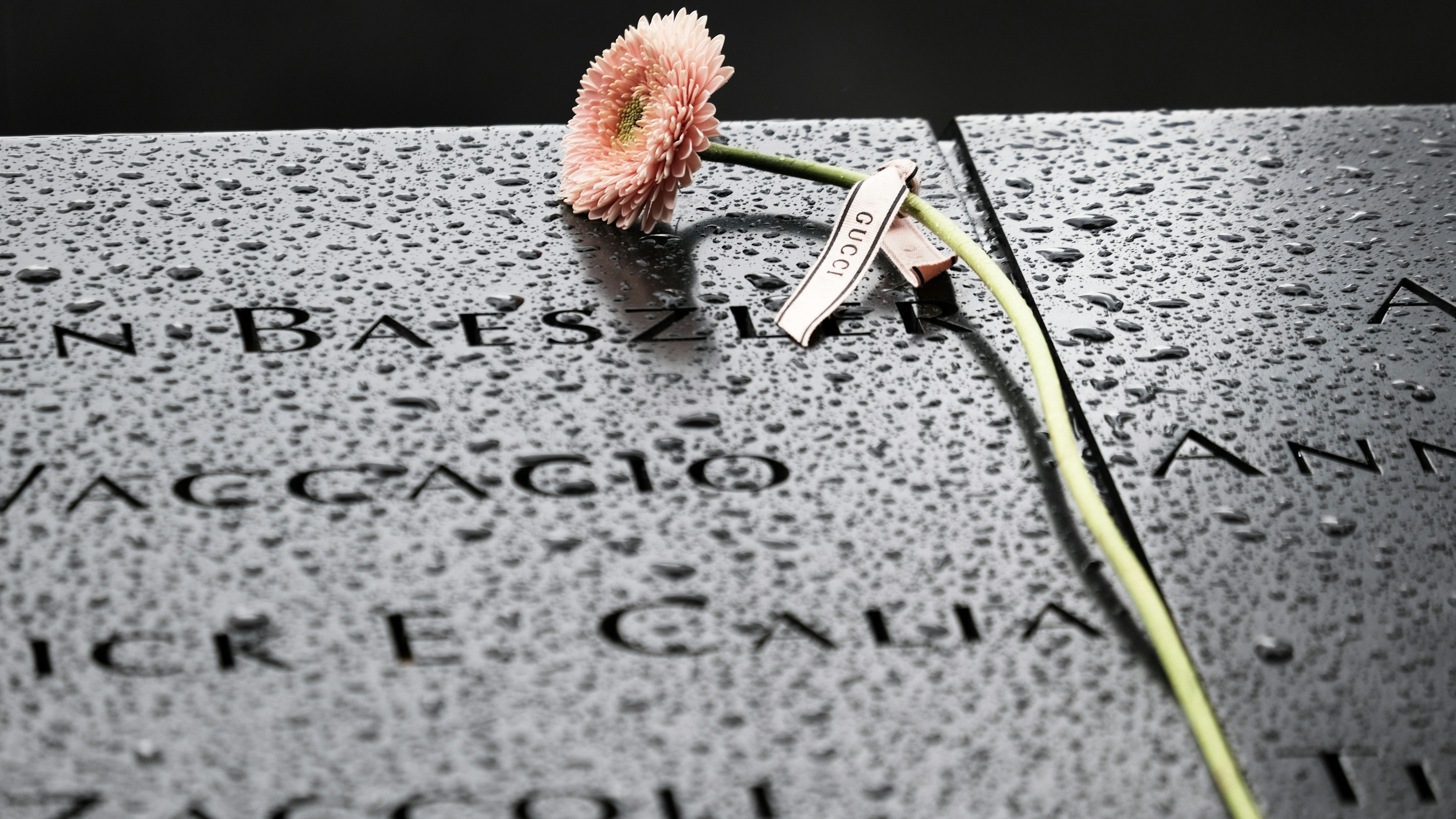 Flowers are placed over names at the September 11th Memorial on September 9, 2021 in New York City.