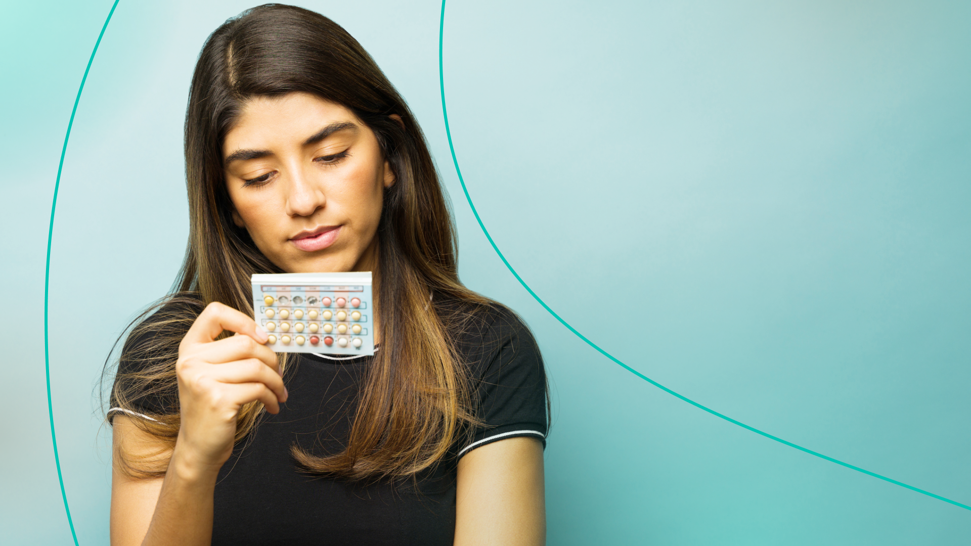 Woman examining bc pills