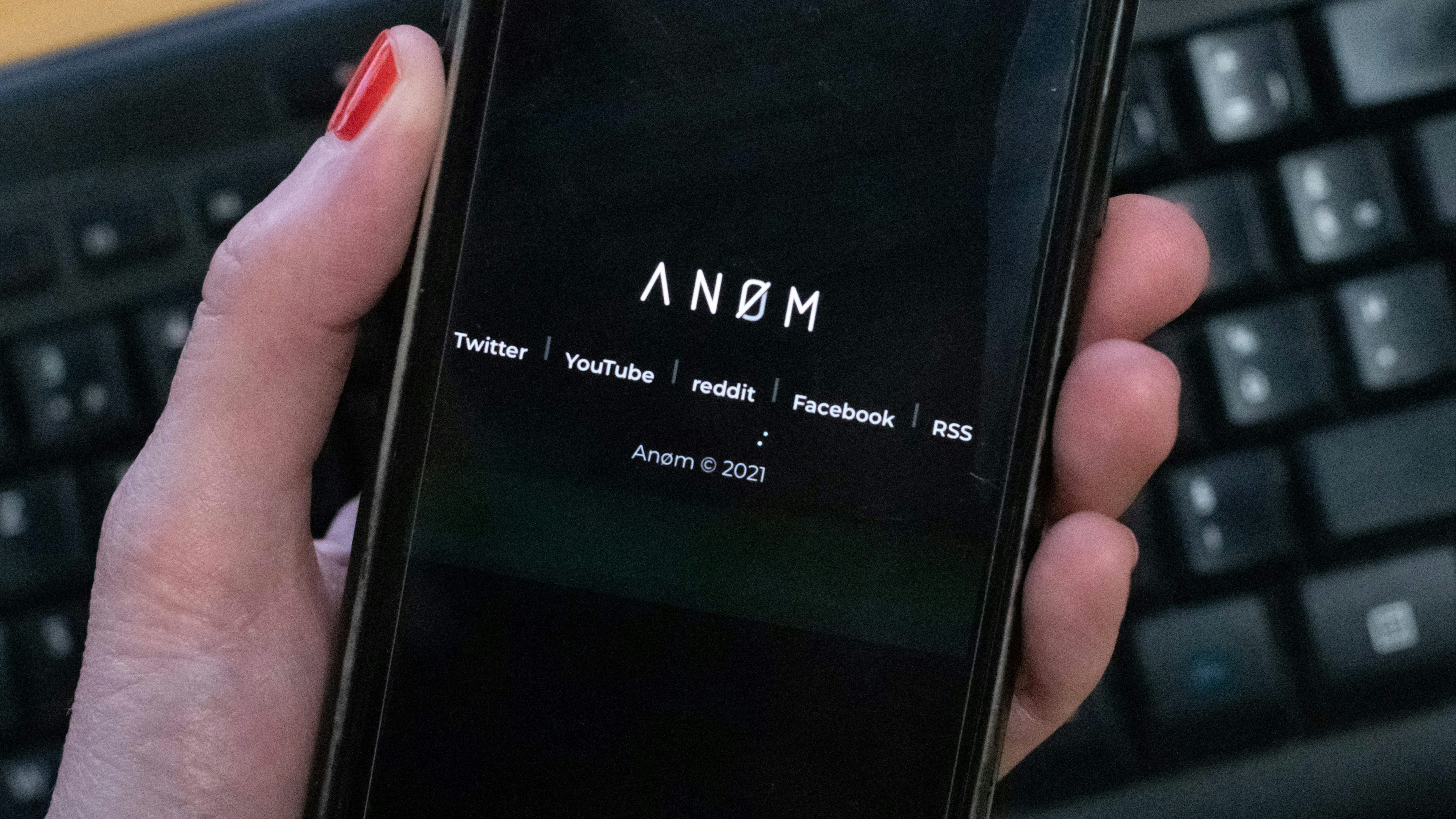 An illustration picture shows the ANoM logo displayed on the screen of an smartphone on june 8, 2021 in Paris.