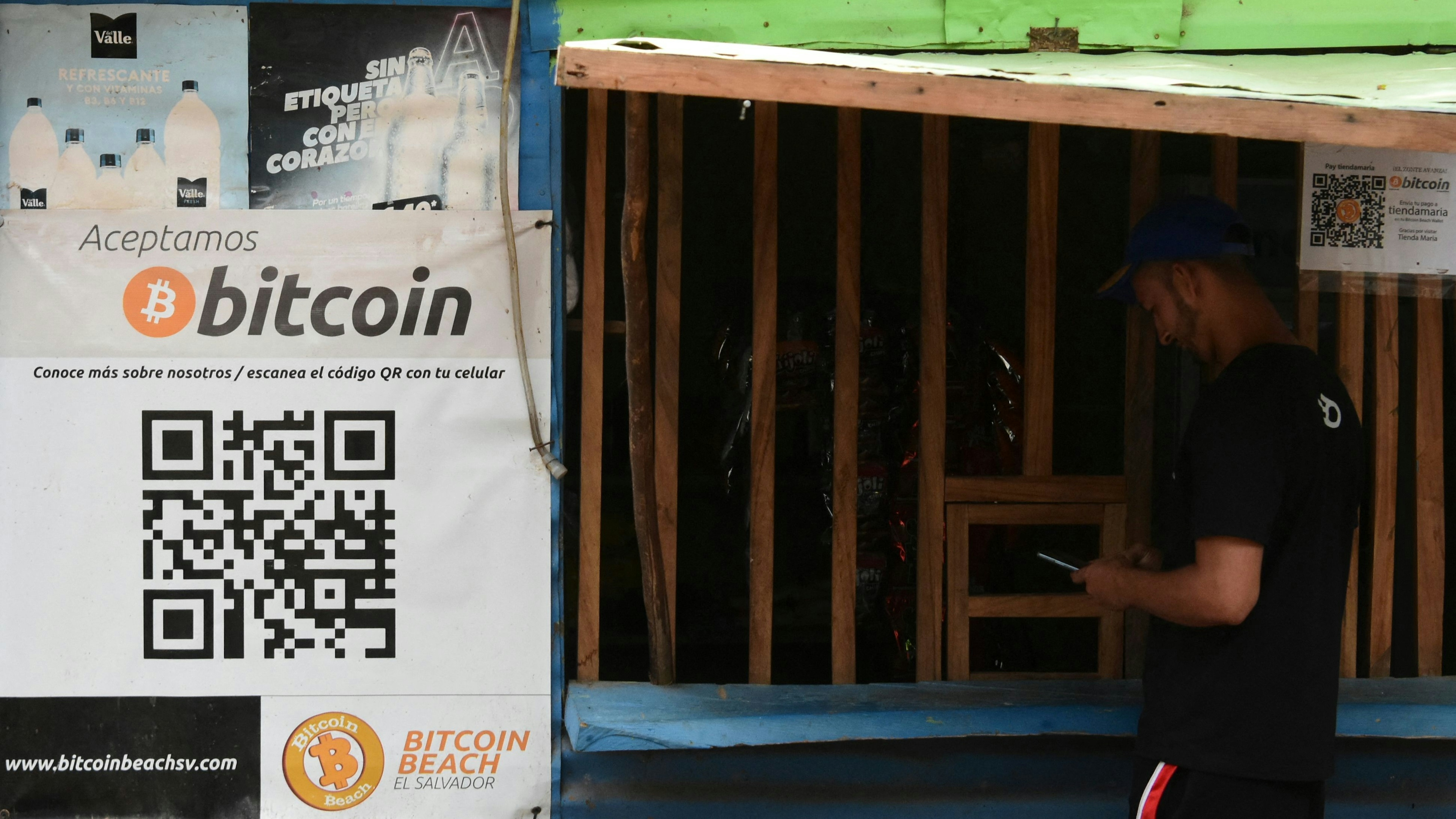 A man buys in a store that accepts bitcoins in El zonte.