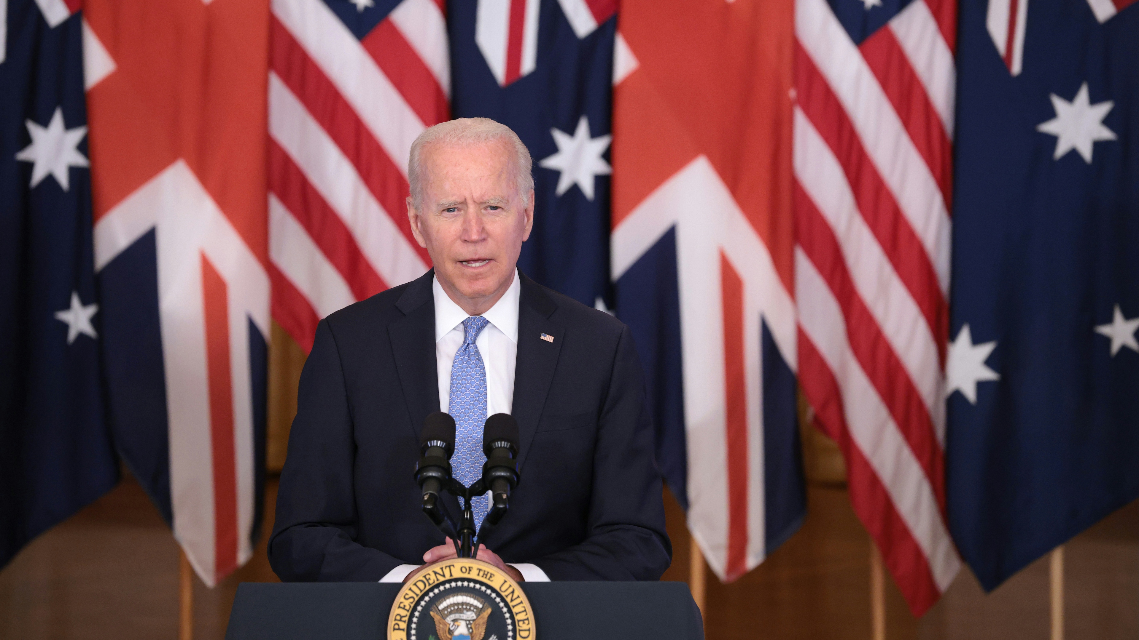President Joe Biden speaks during an event in the East Room of the White House