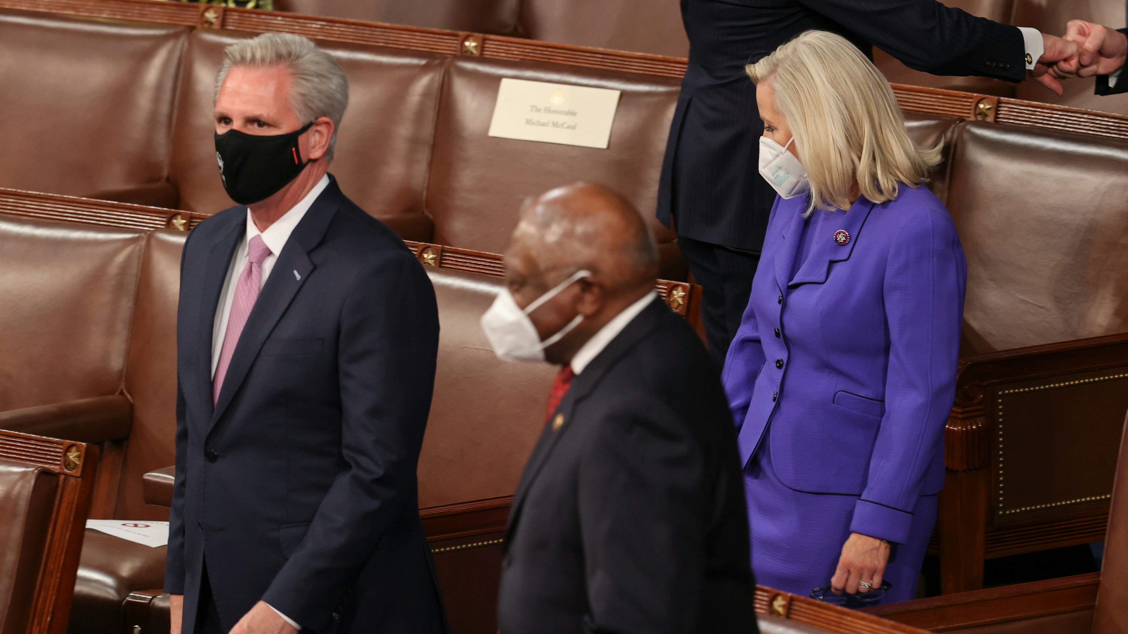 U.S. House Minority Leader Kevin McCarthy (R-CA) and House Republican Conference Chairperson Rep. Liz Cheney (R-WY) pass Rep. James Clyburn (D-SC) as they arrive to attend U.S. President Joe Biden address