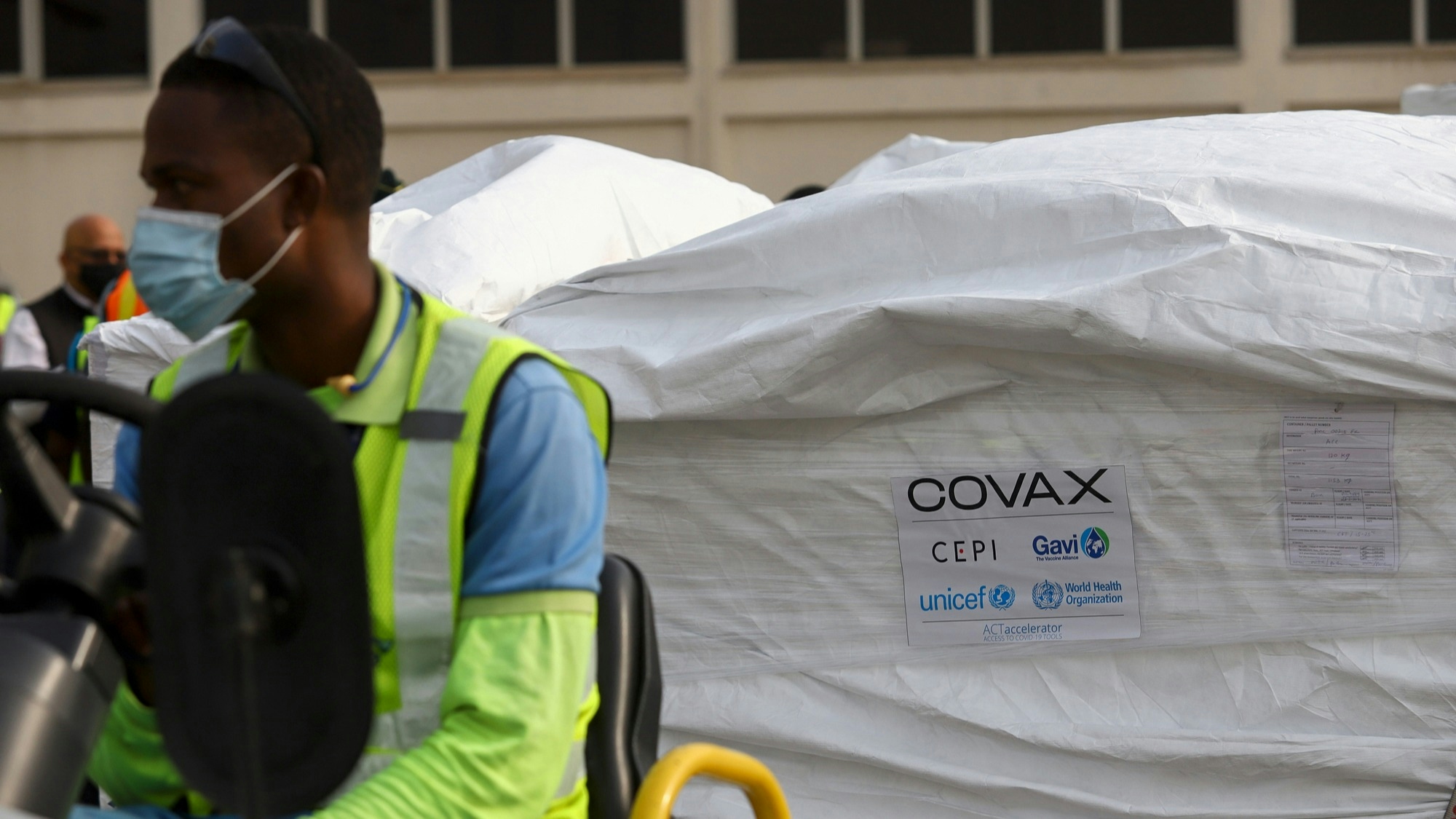 This photograph taken on February 24, 2021 shows a Covax tag on a shipment of Covid-19 vaccines from the Covax global Covid-19 vaccination programme, at the Kotoka International Airport in Accra.