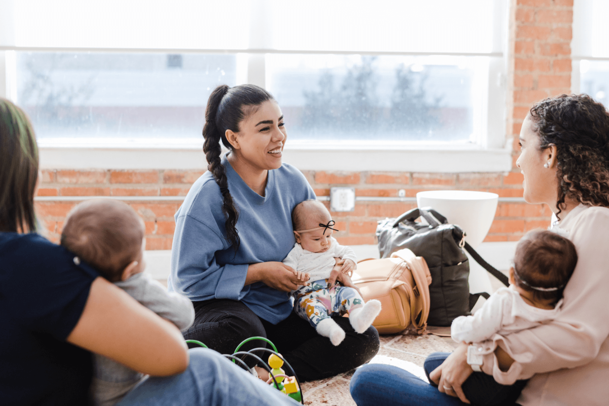 group of moms with their babies