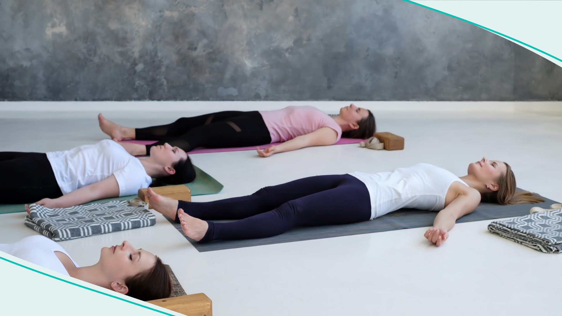 Women resting during a yoga class