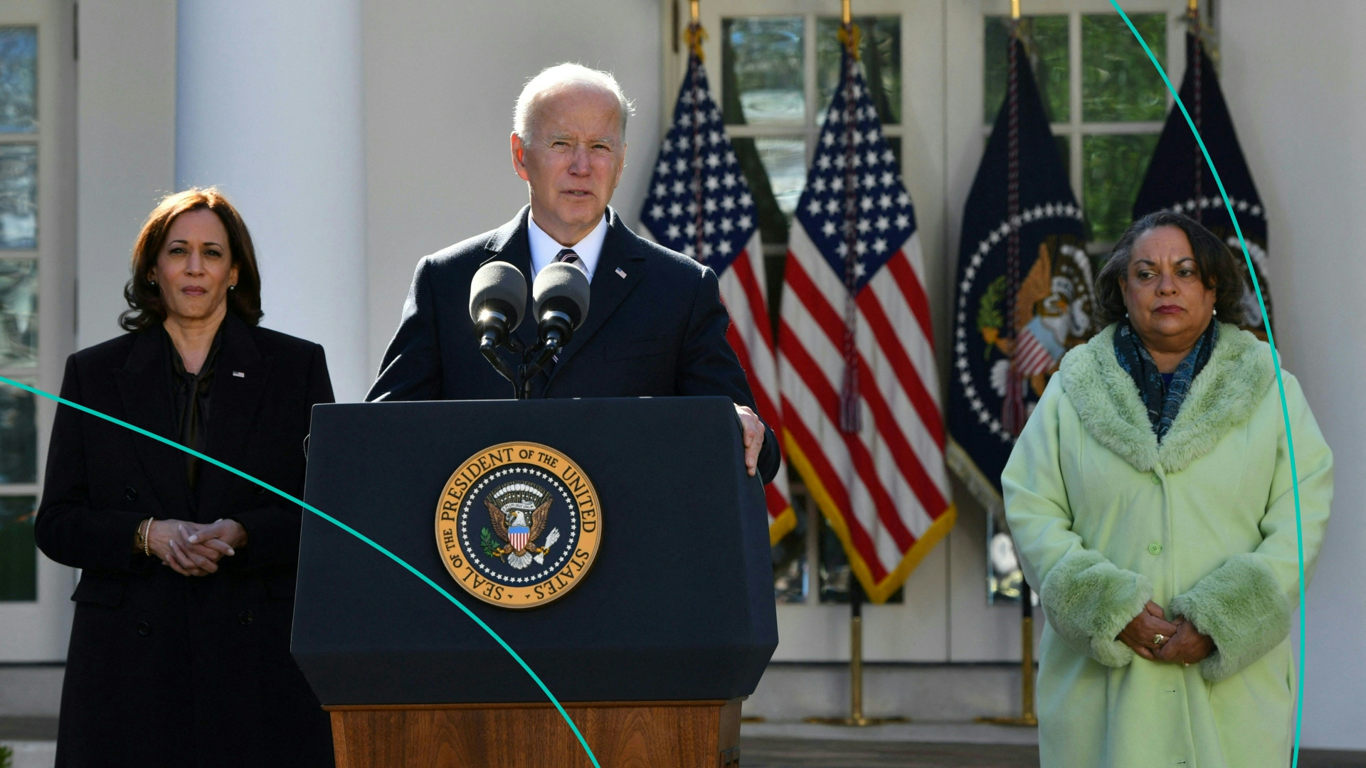 US President Joe Biden speaks as Michelle Duster (R), great-granddaughter of civil rights pioneer Ida B. Wells, and Vice President Kamala Harris (L) listen after signing the Emmett Till Anti-lynching Act