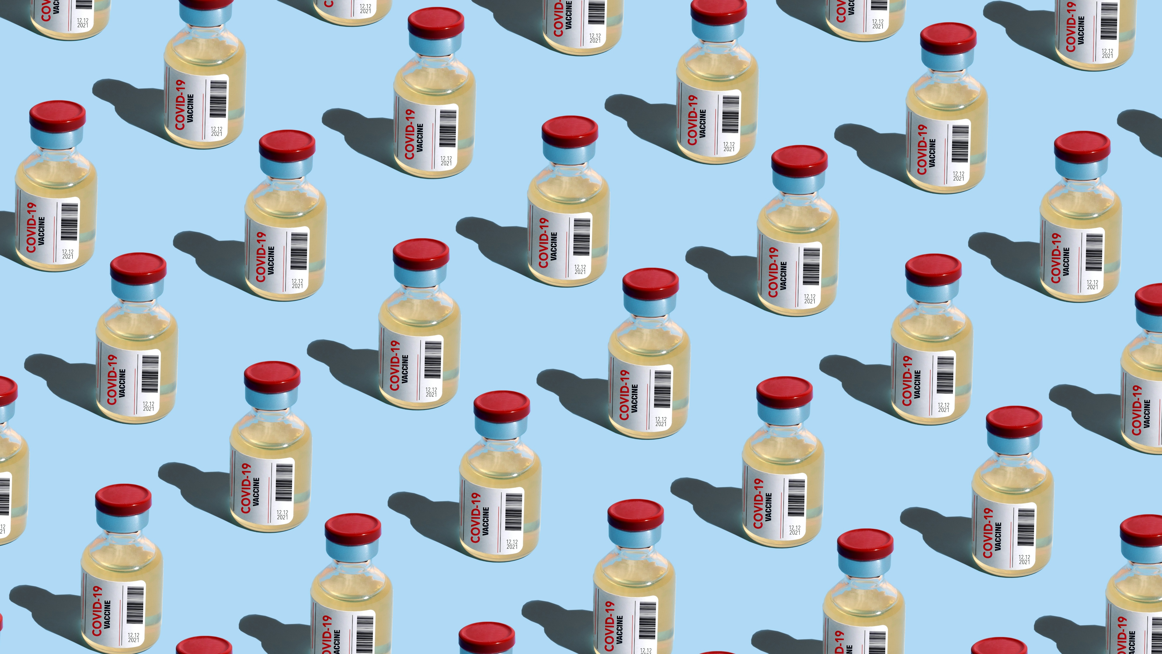 Repeated vials with covid-19 vaccine on the blue background