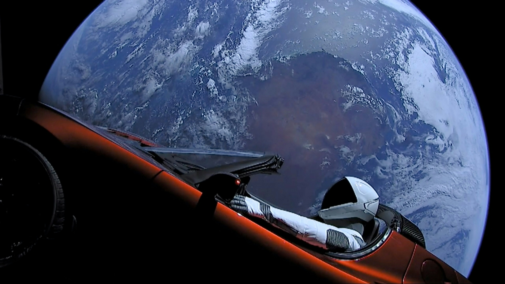 Tesla roadster launched from the Falcon Heavy rocket with a dummy driver named "Starman" heads towards Mars.