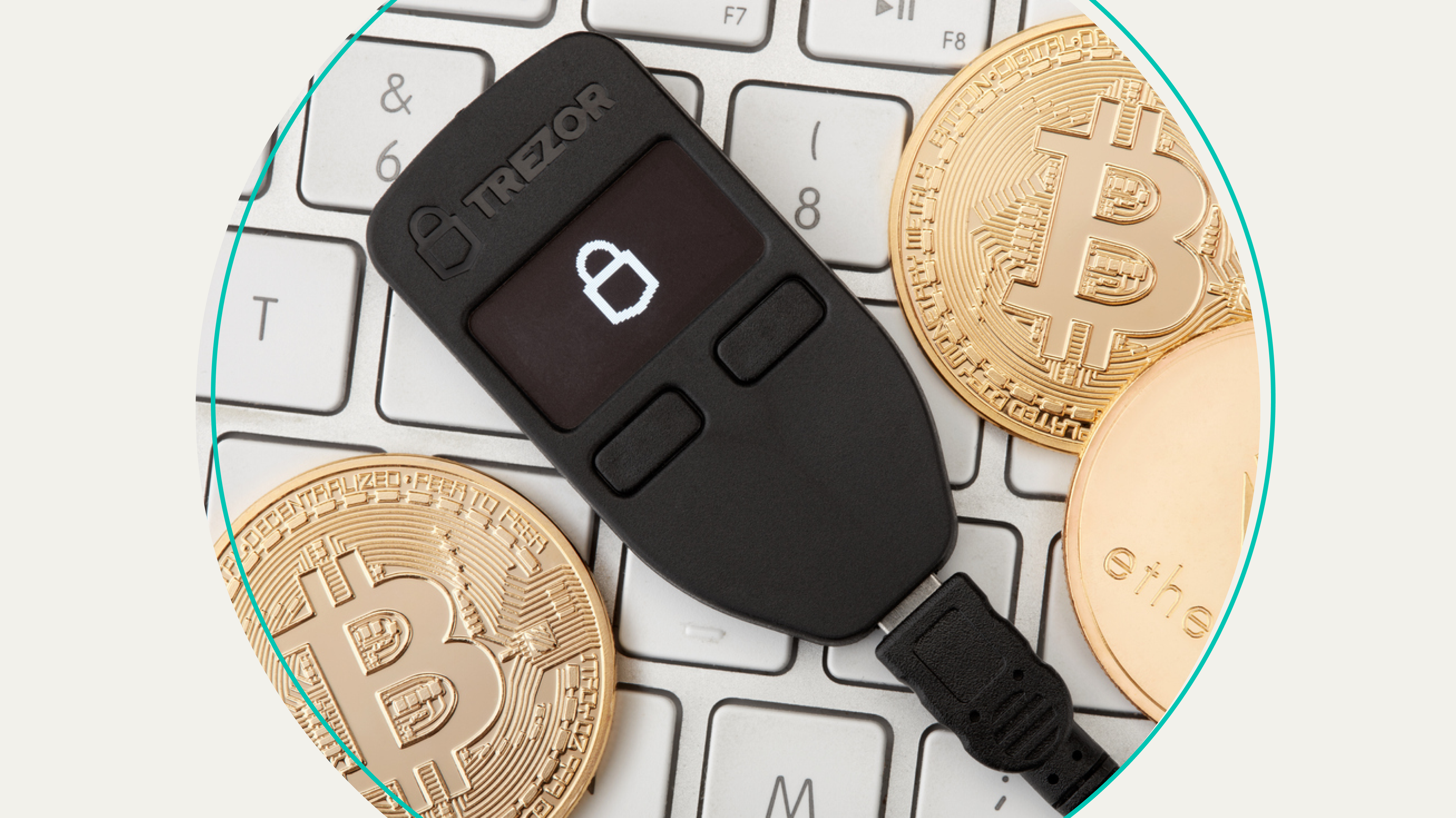A hardware wallet surrounded by bitcoins.