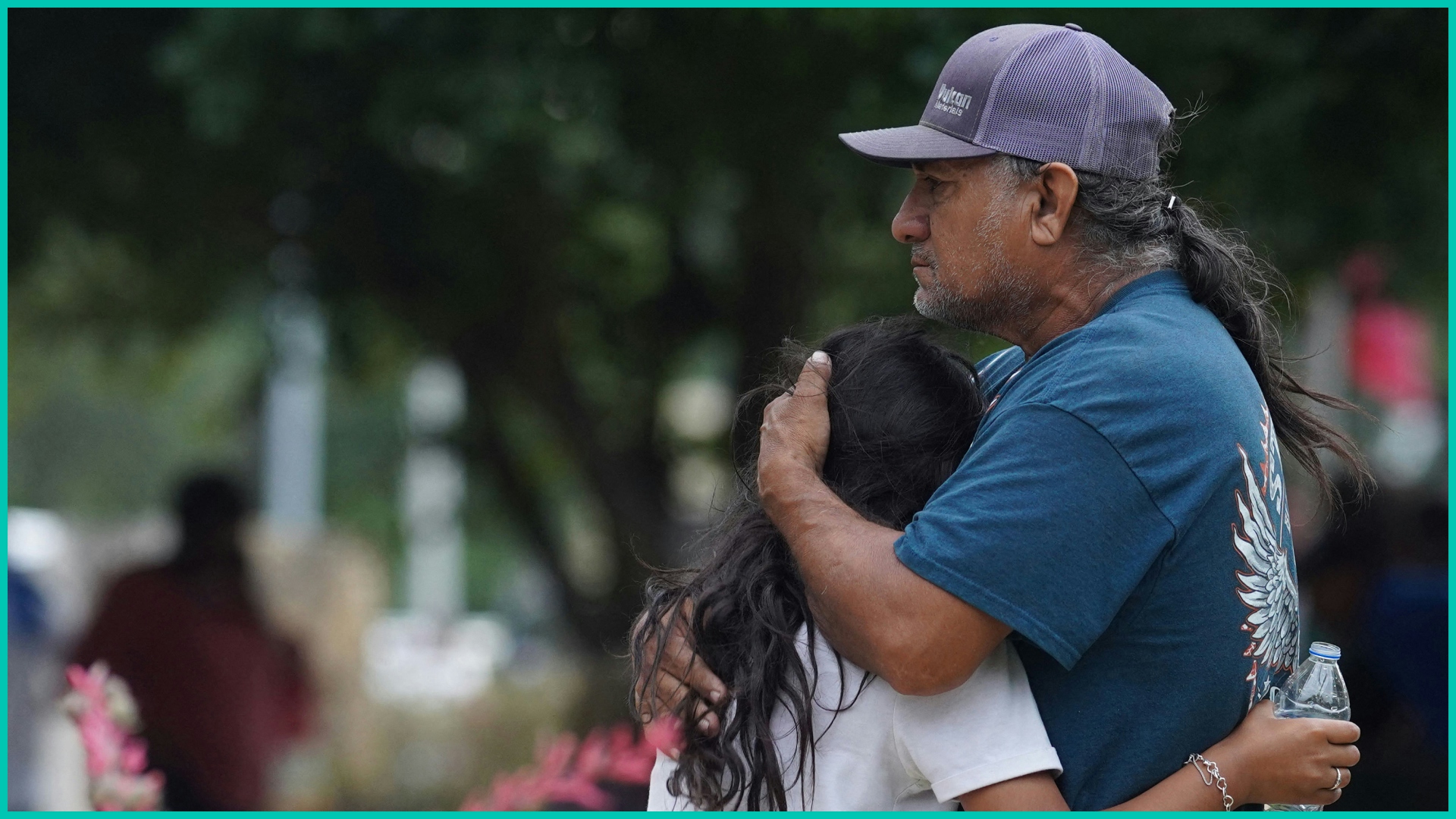 Families hug outside the Willie de Leon Civic Center where grief counseling will be offered in Uvalde, Texas, on May 24, 2022