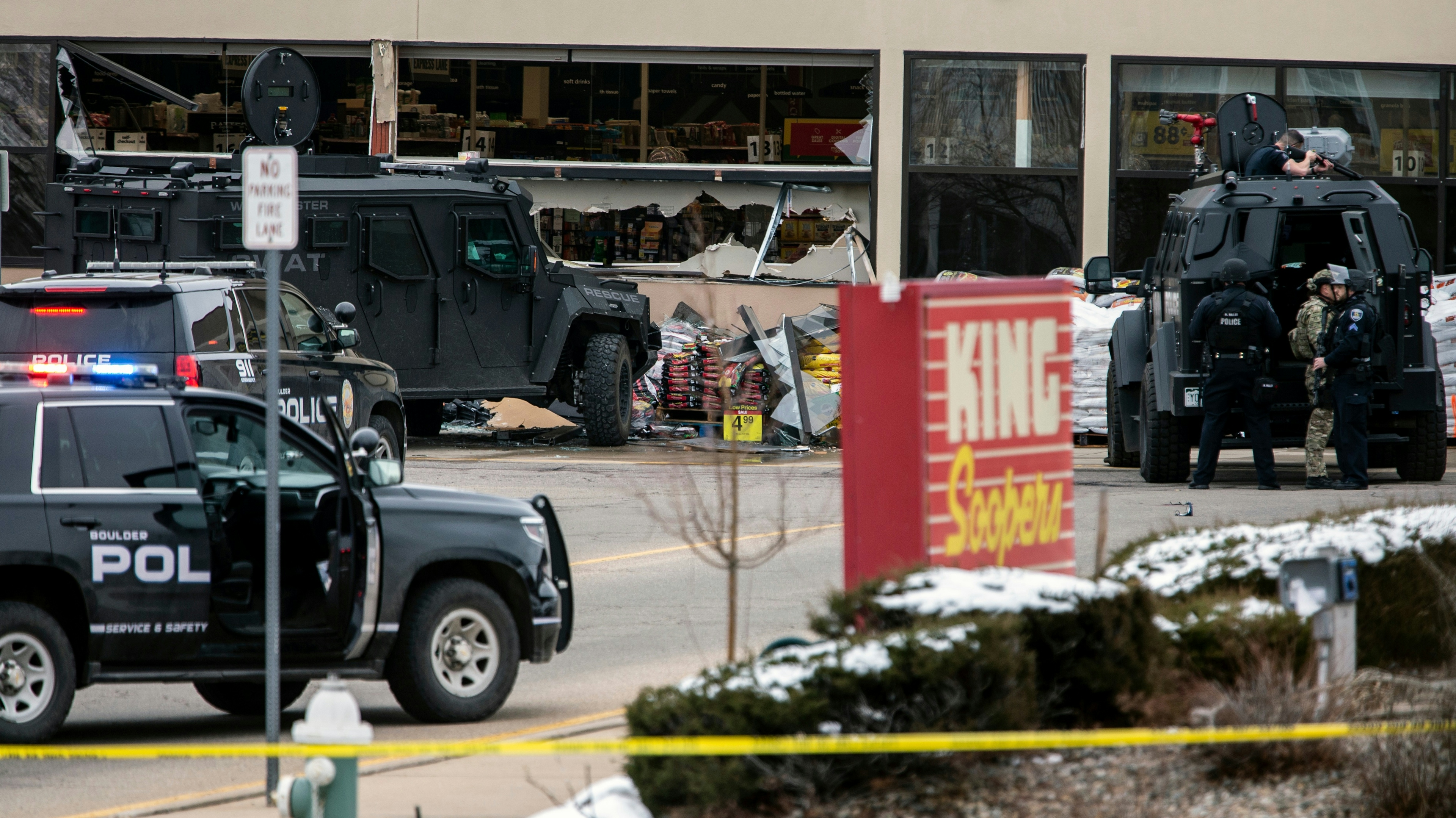 Smashed windows are left at the scene after a gunman opened fire at a King Sooper's grocery store on March 22, 2021 in Boulder, Colorado