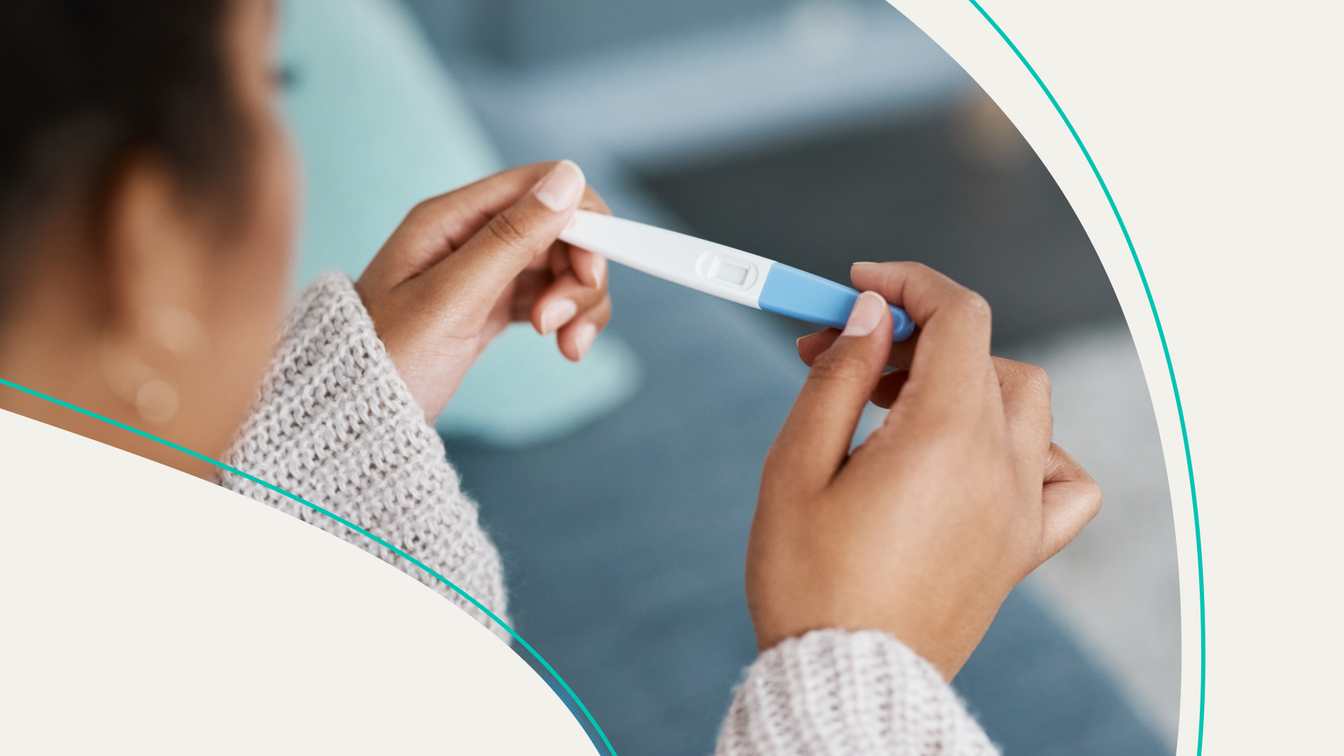 A woman holding a pregnancy test