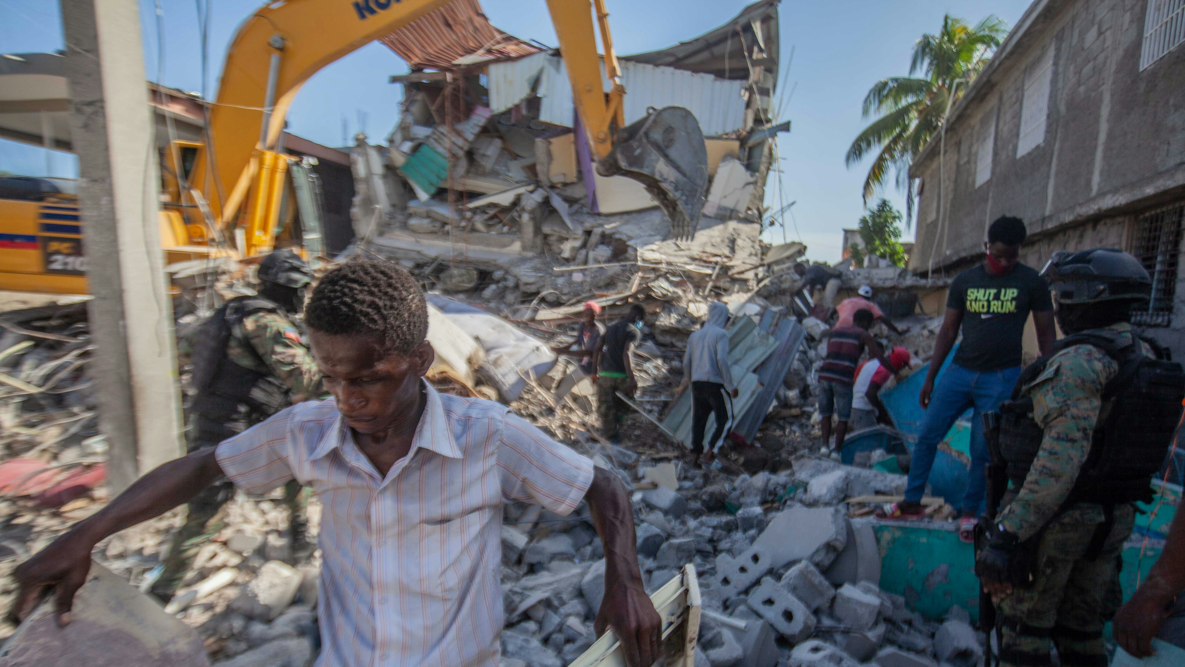 Haitians begin the work of recovering what materials can be after a 7.2-magnitude earthquake struck Haiti on August 15, 2021 in Les Cayes, Haiti.