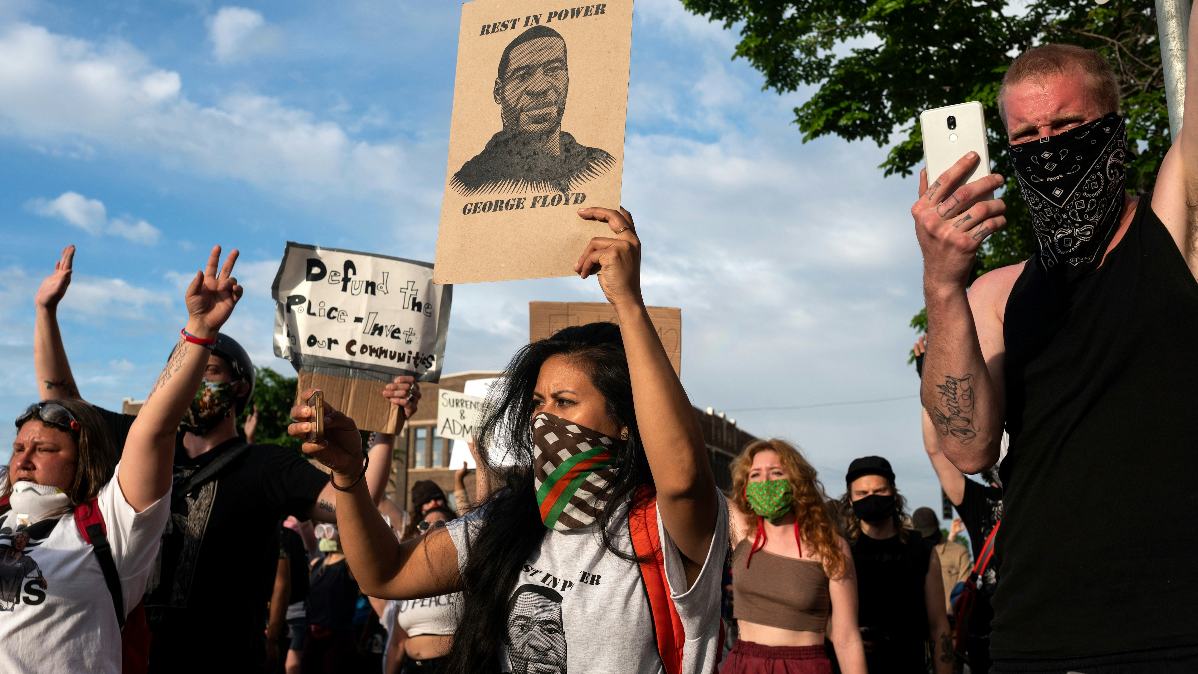 Protesters confront police outside the 3rd Police Precinct on May 27, 2020