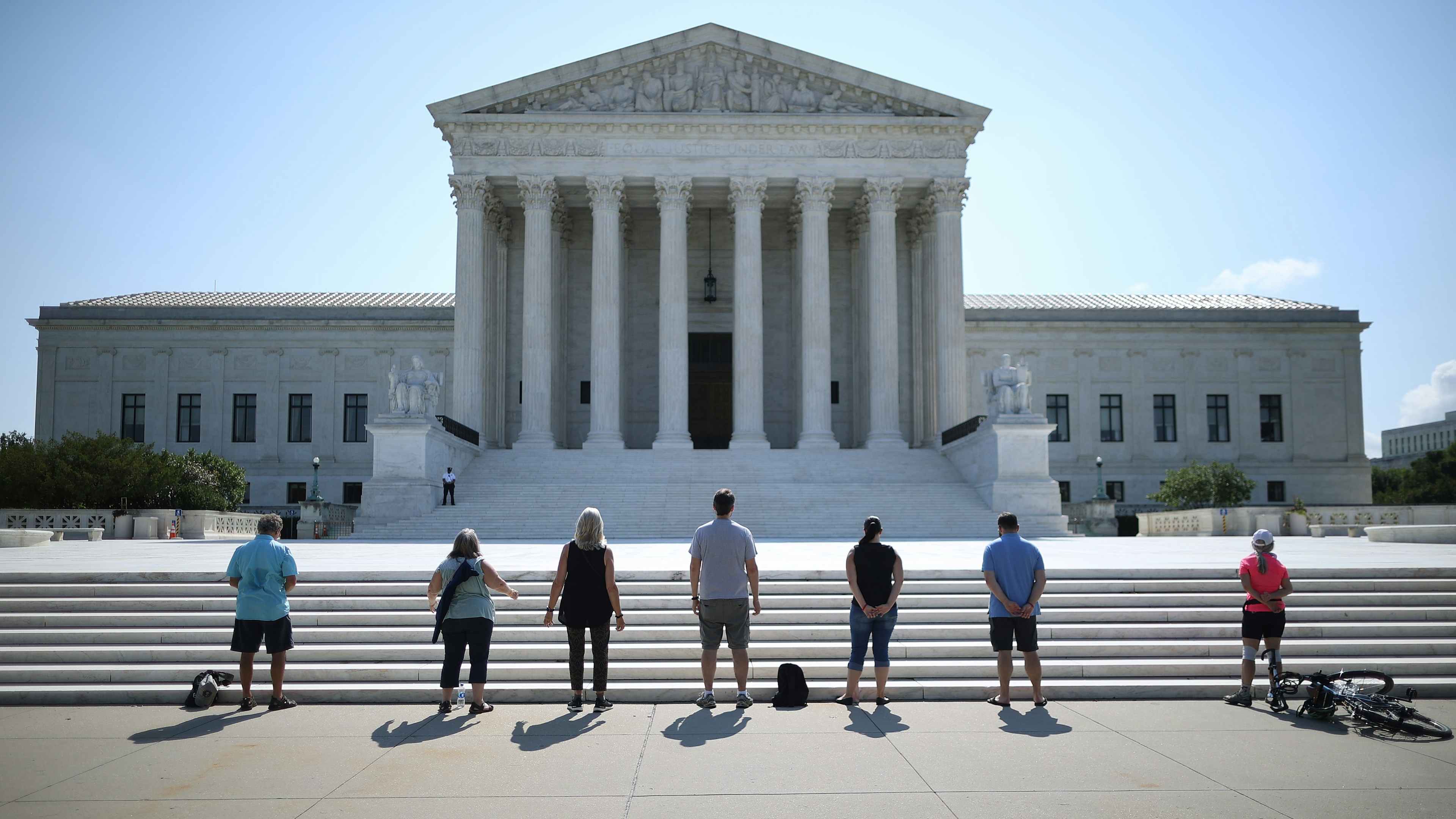 Anti-abortion demonstrators pray in front of the U.S. Supreme Court on July 08, 2020.