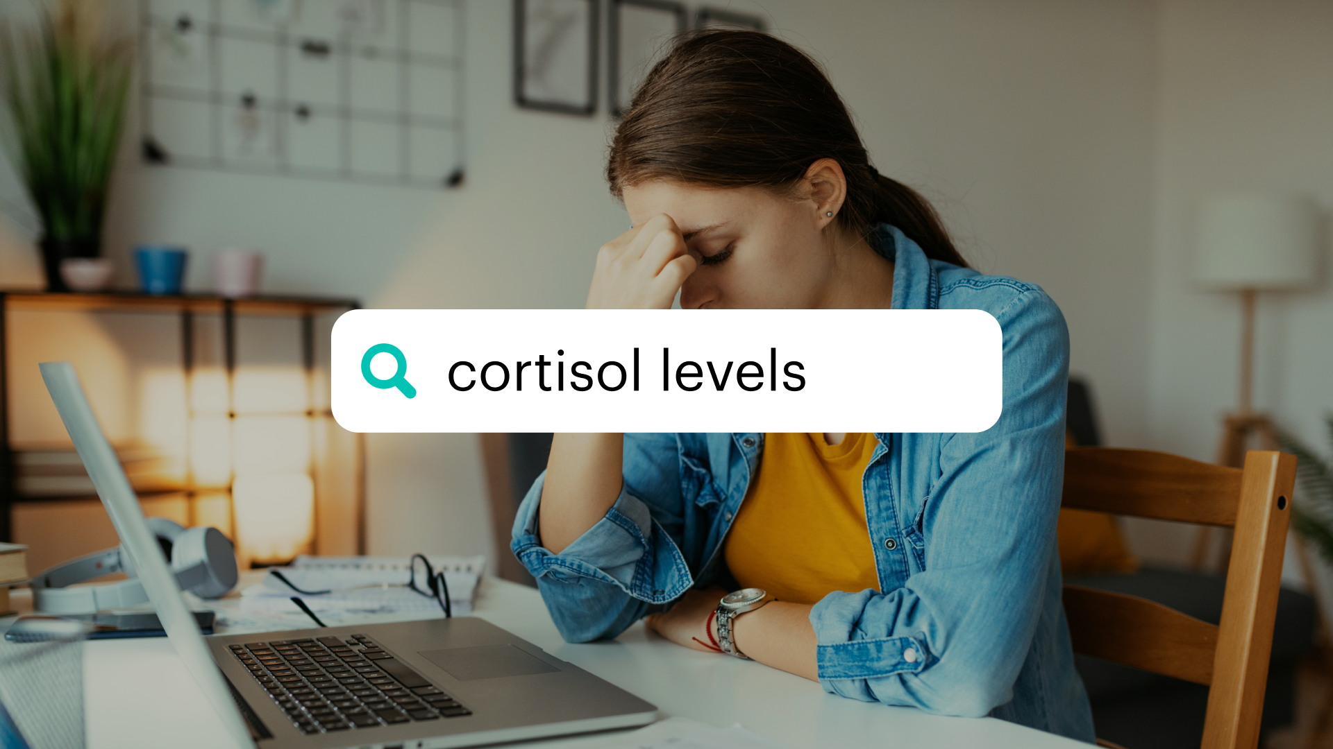 Woman looking stressed at laptop with cortisol levels search bar overlaid