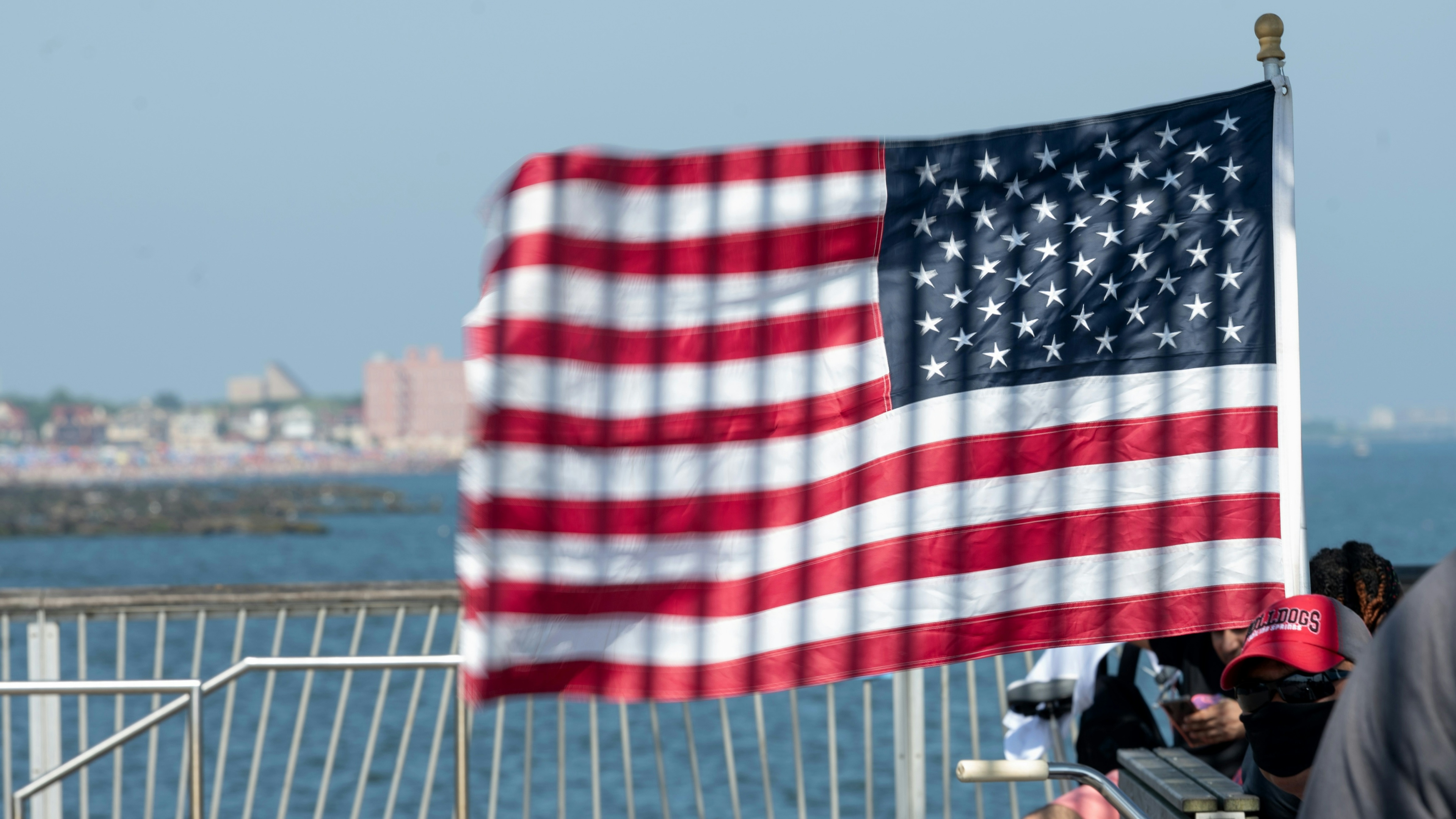 An American flag waves on the pier at Coney Island.